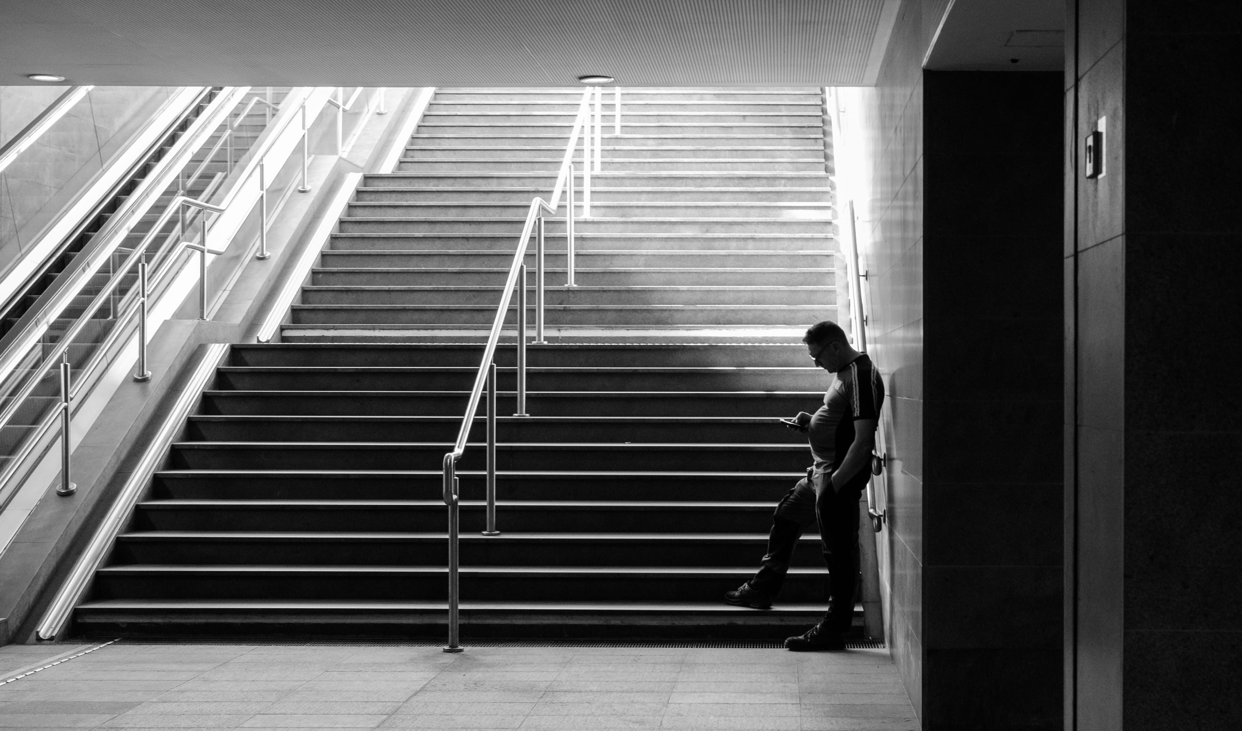 outdoors, black, real people, lifestyles, building, brescia, walking, side view, blacknwhite, nature, one person, 4K, italy, men, staircase, standing, HD Wallpaper