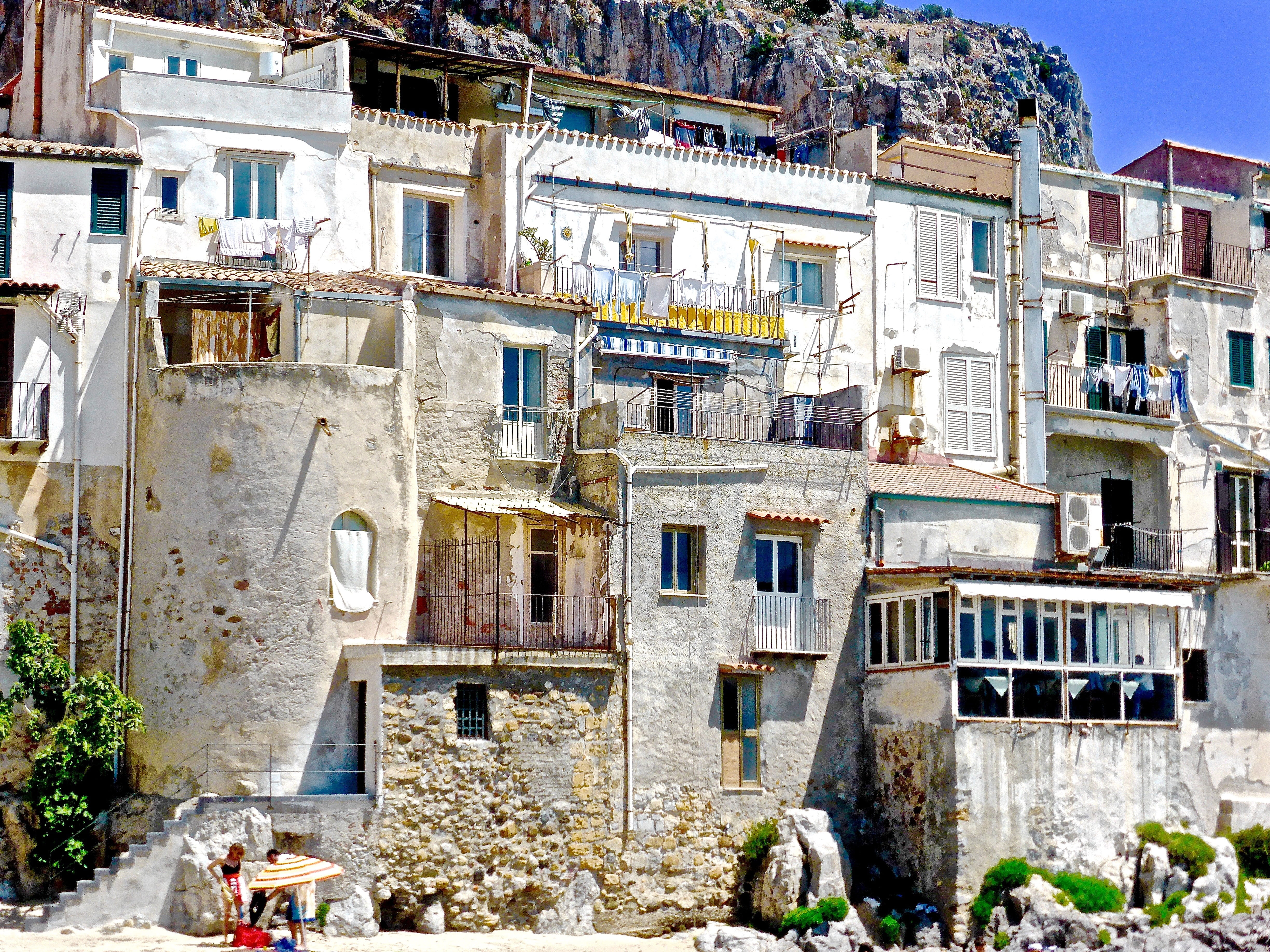 building exterior, nature, water, concrete, incidental people, no people, stone, house, beside, old, hilly, traditional, day, rock, built structure, town, HD Wallpaper