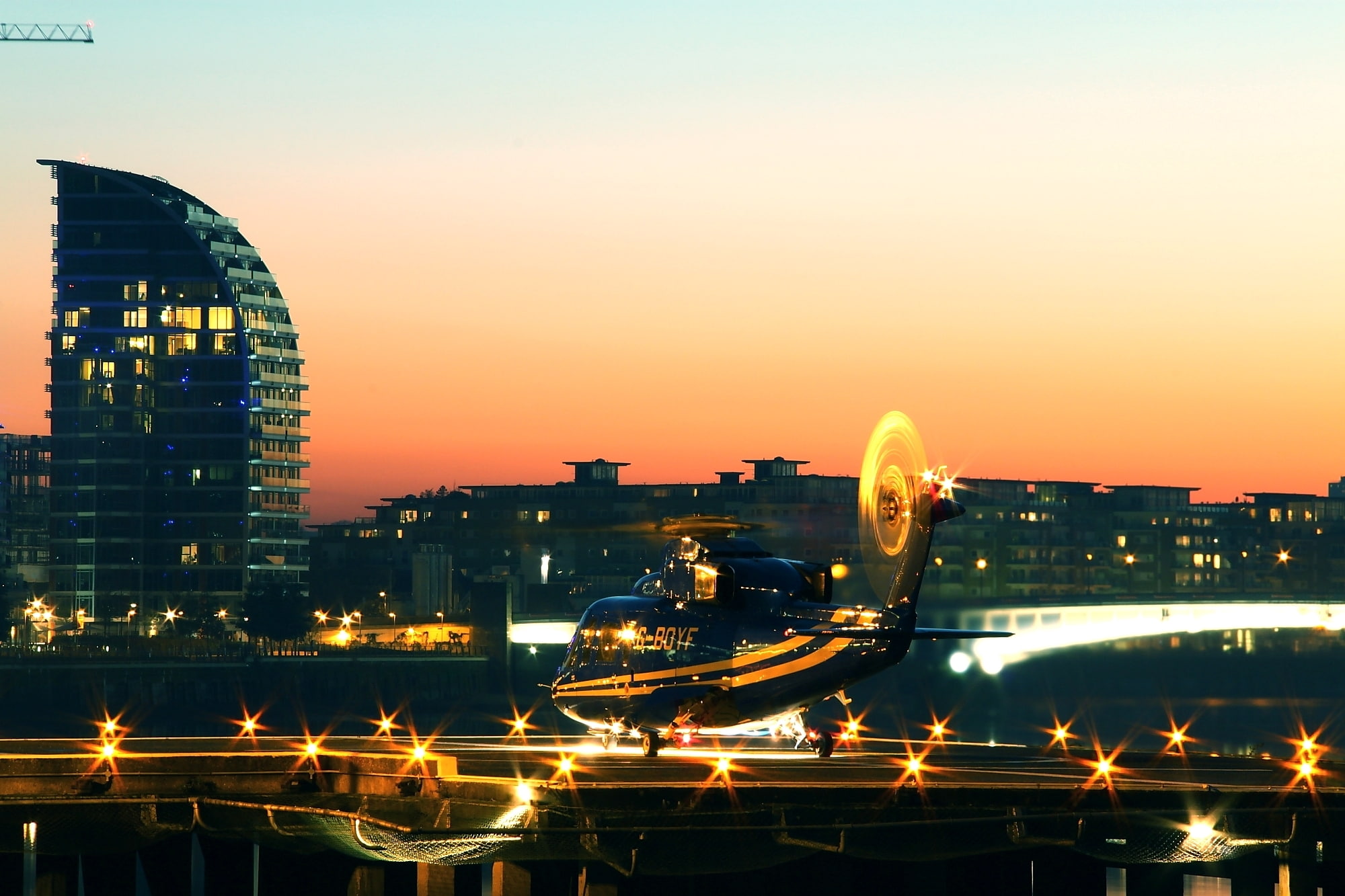 helicopter, London Heliport, helipad, sunset, landing lights, the evening, 1080P, HD Wallpaper