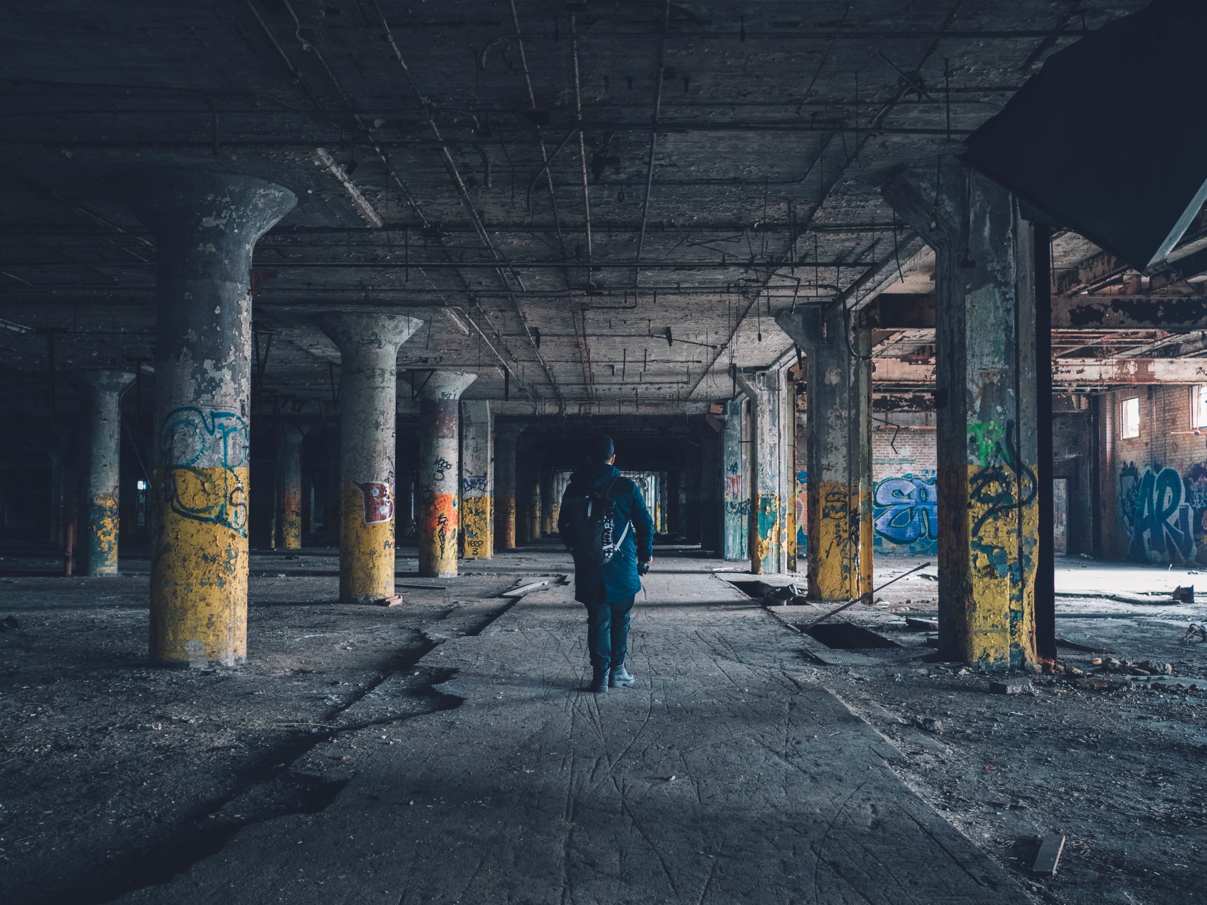 spray paint, men, lifestyles, abandoned, tresspass, urban decay, man, ceiling, one man only, graffiti, rear view, one person, transportation, architectural column, HD Wallpaper