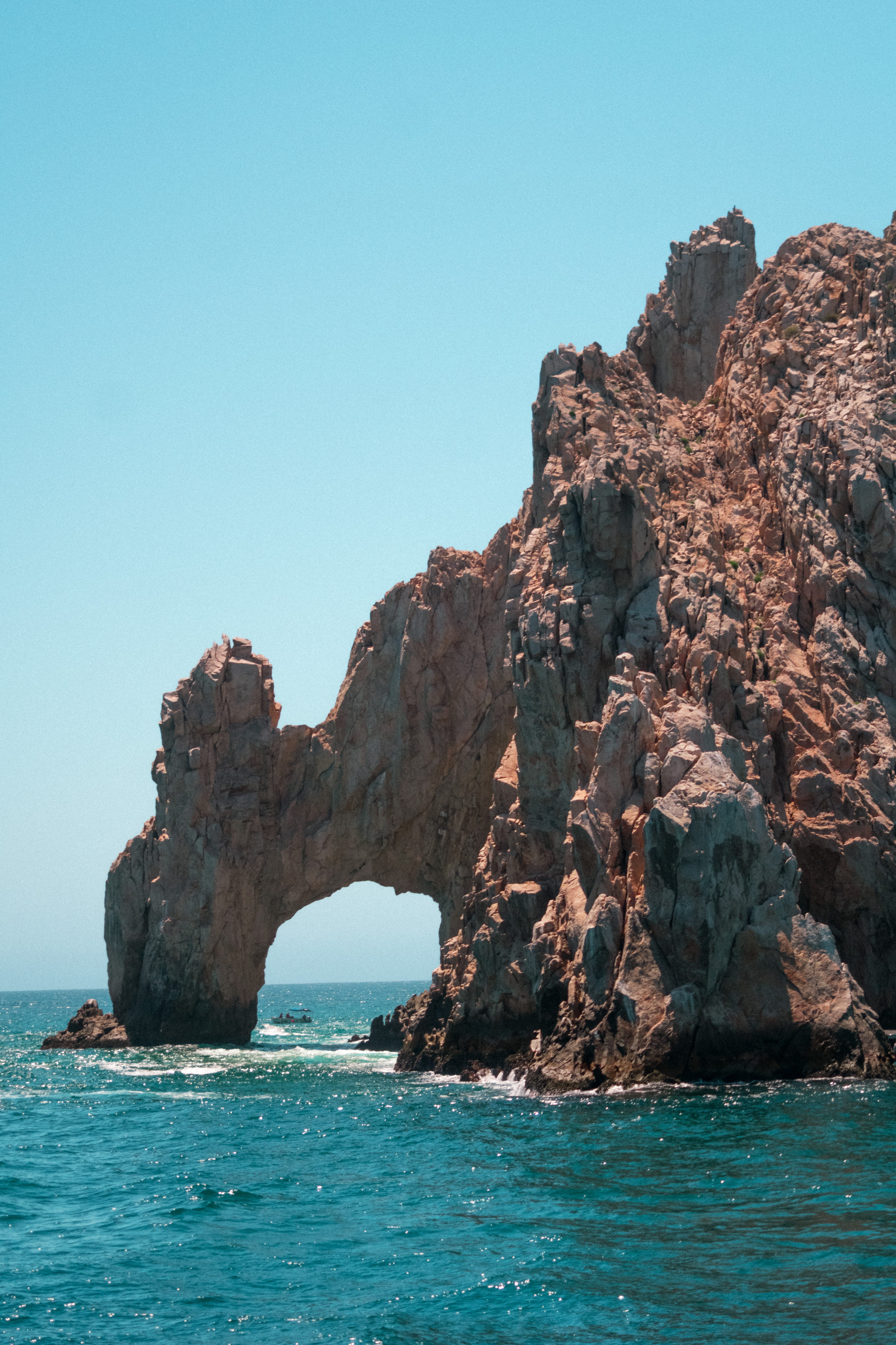 tranquility, solid, clear sky, arch, rock, tranquil scene, water, boat, sky, cabo, rock formation, nature, waterfront, copy space, outdoors, day, no people, Phone HD Wallpaper