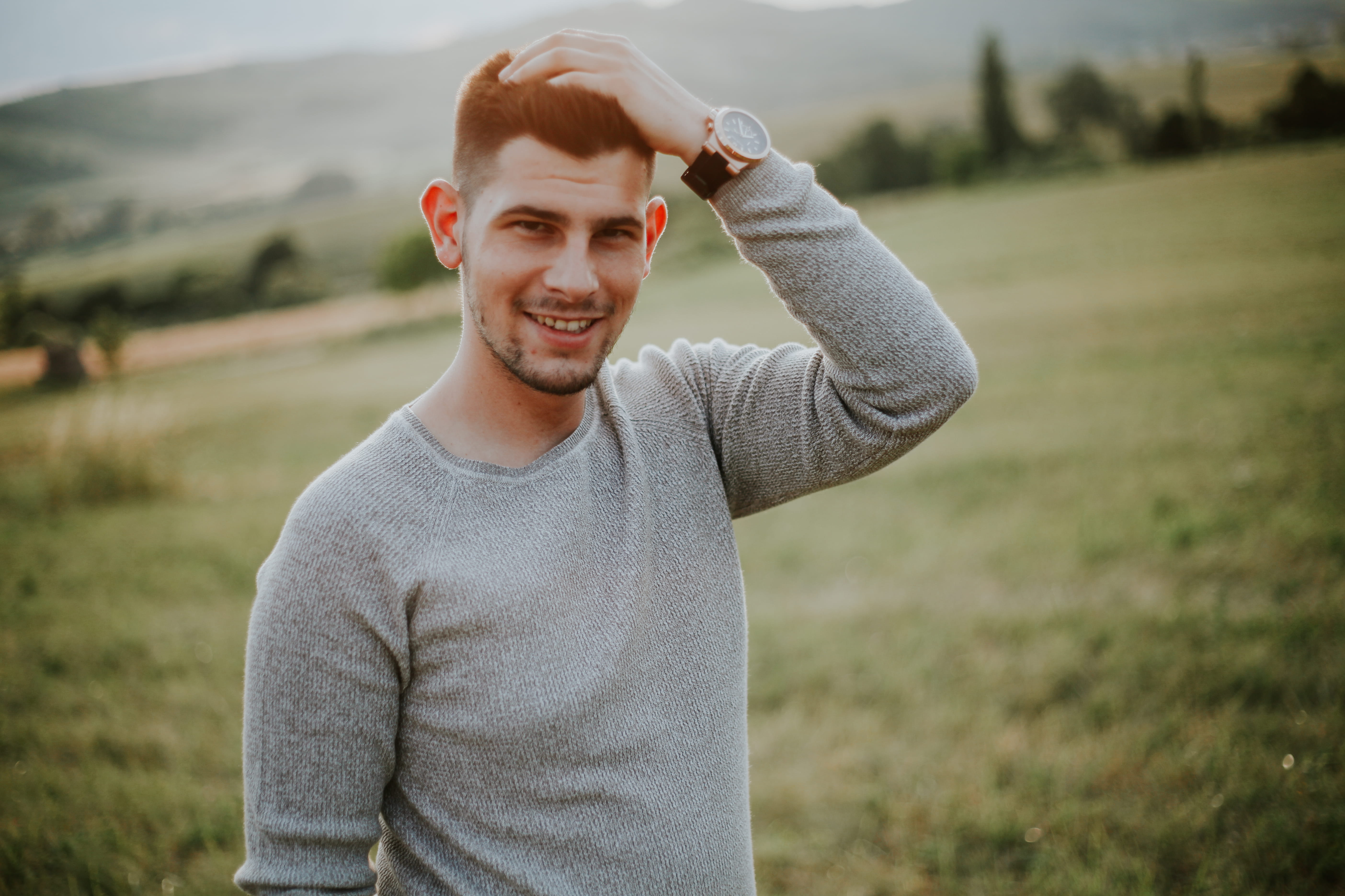 looking at camera, smiling, outdoor, front view, one person, young men, fielf, hand on head, young adult, leisure activity, man, plant, waist up, nature, HD Wallpaper