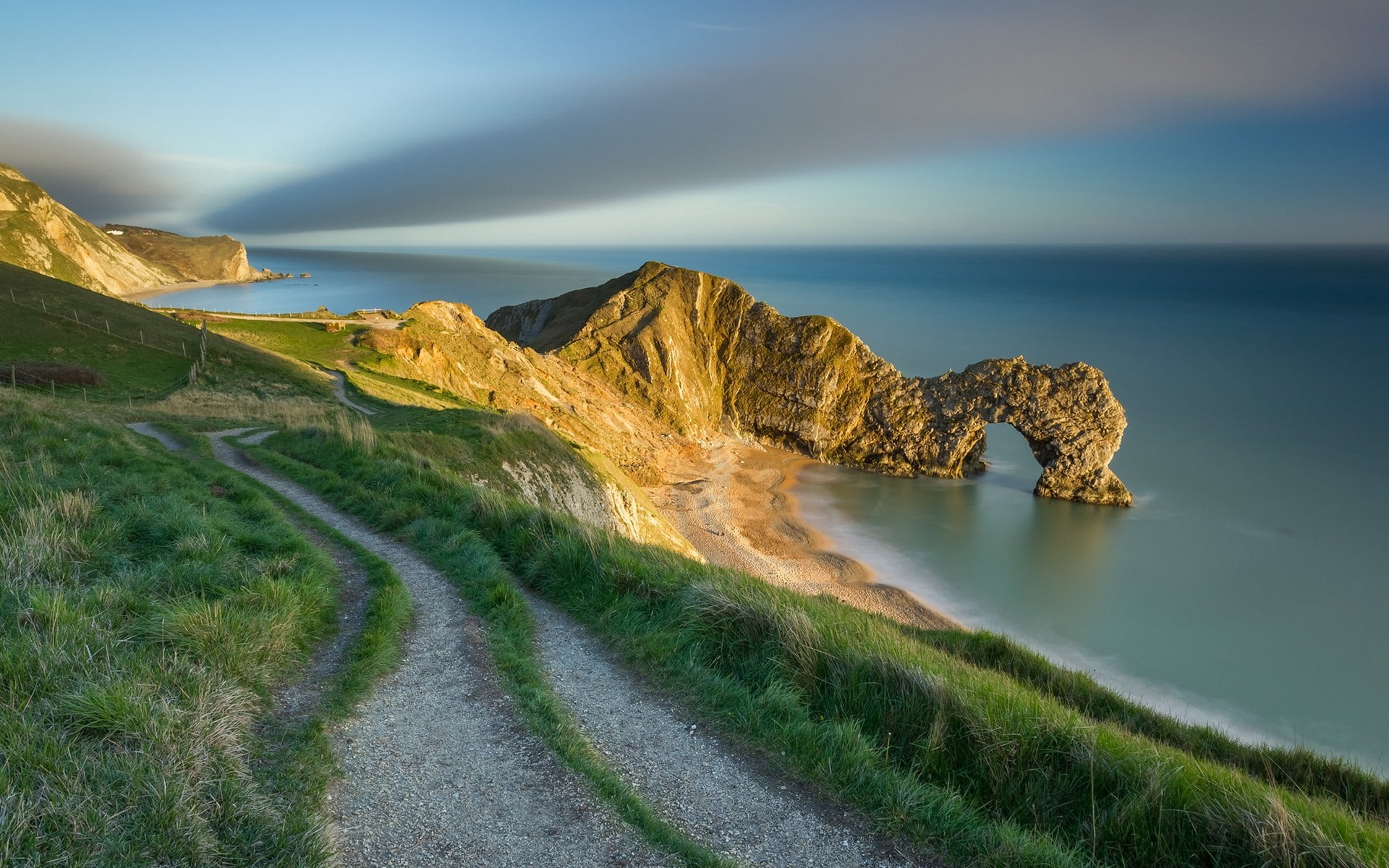 landscape, field, sunlight, cliff, sunset, sky, horizon, England, beach, UK, hills, arch, rock, sea, clouds, fence, Durdle Door, nature, sand, rock formation, HD Wallpaper
