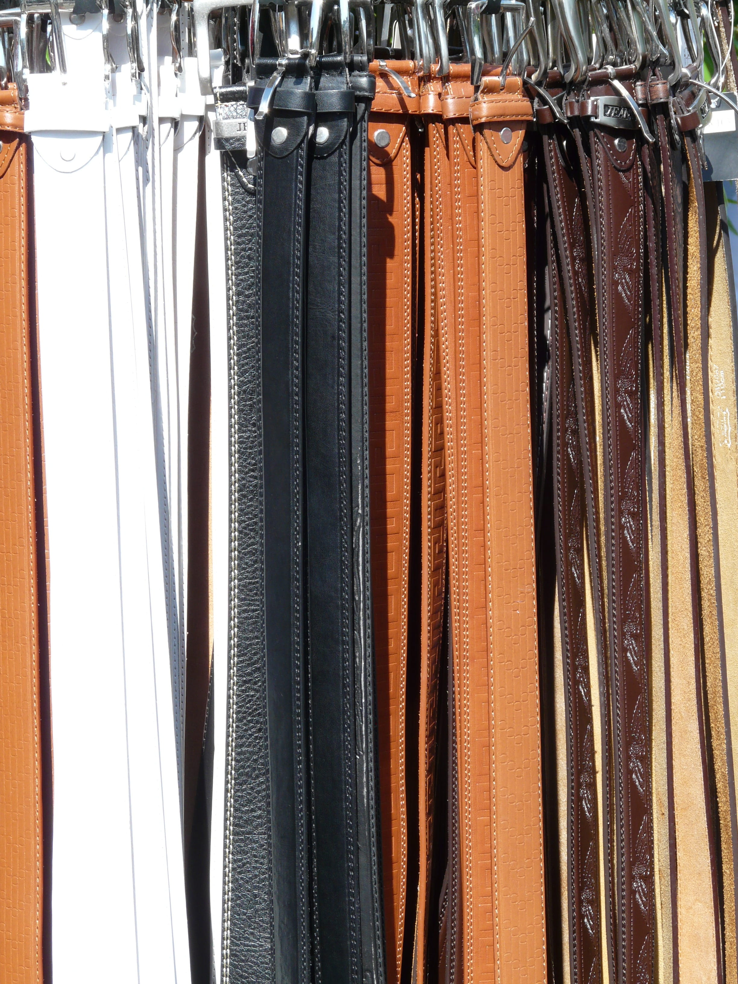 coathanger, indoors, in a row, leather goods, variation, side by side, 2K, fashion, arrangement, mass, hanging, no people, still life, store, clothing, Phone HD Wallpaper