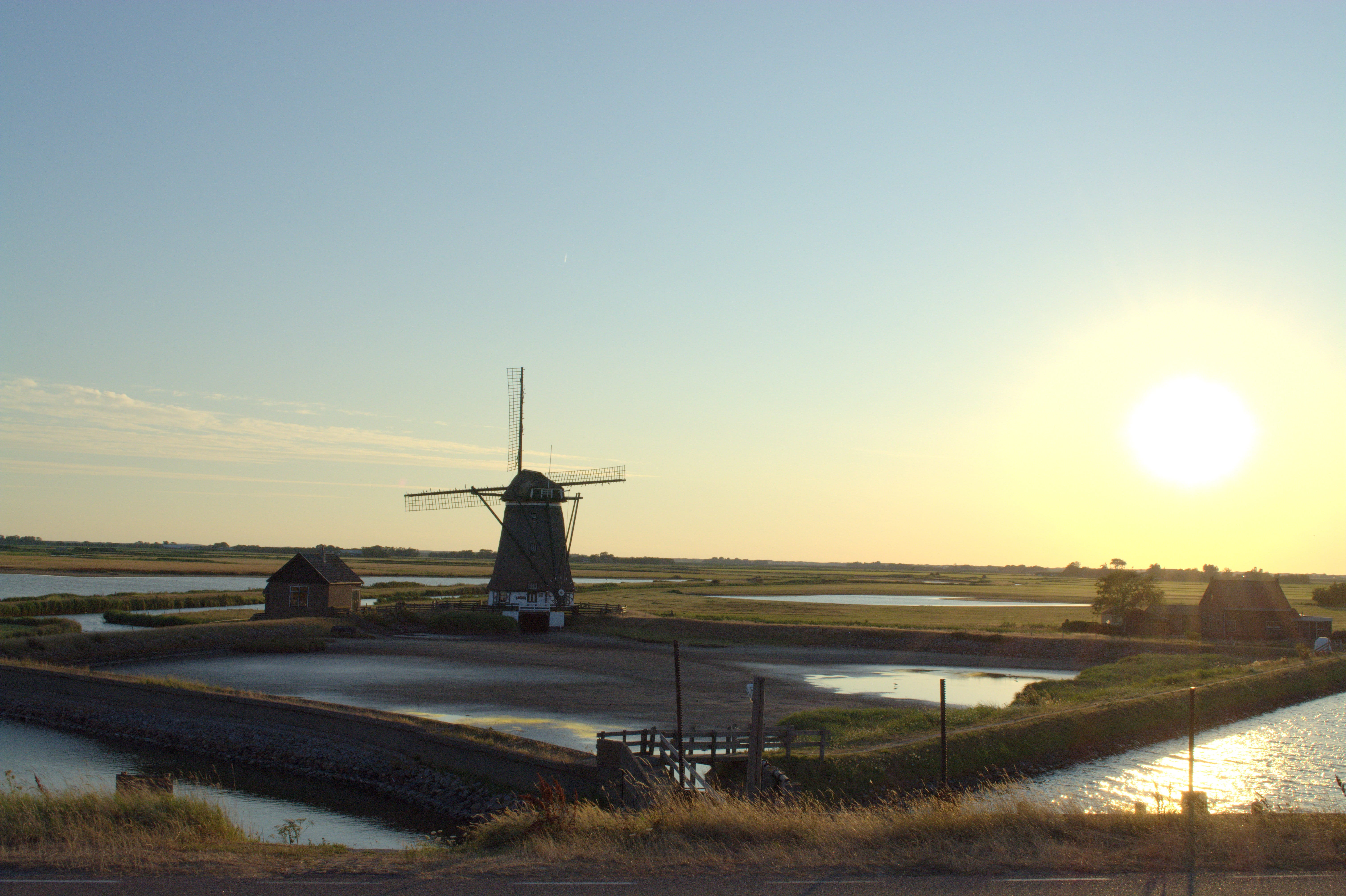 wind power, travel, sky, lens flare, nature, 5K, environment, sun, land, summer, field, windmill, renewable energy, mill, view, island, panorama, water, HD Wallpaper
