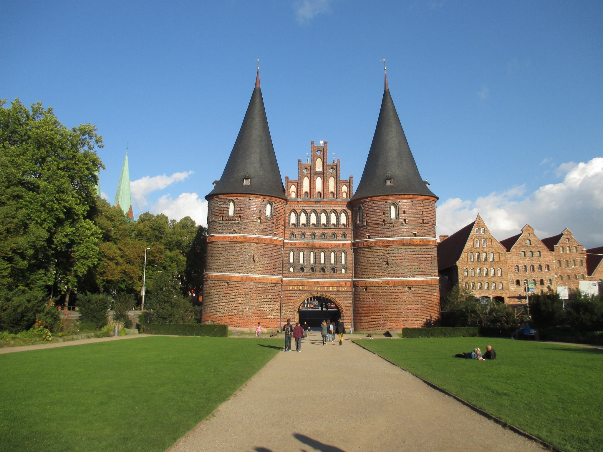 built structure, lübeck, blue, real people, 1080P, spirituality, people, hanseatic city, city gate, incidental people, building, fort, plant, outdoors, HD Wallpaper