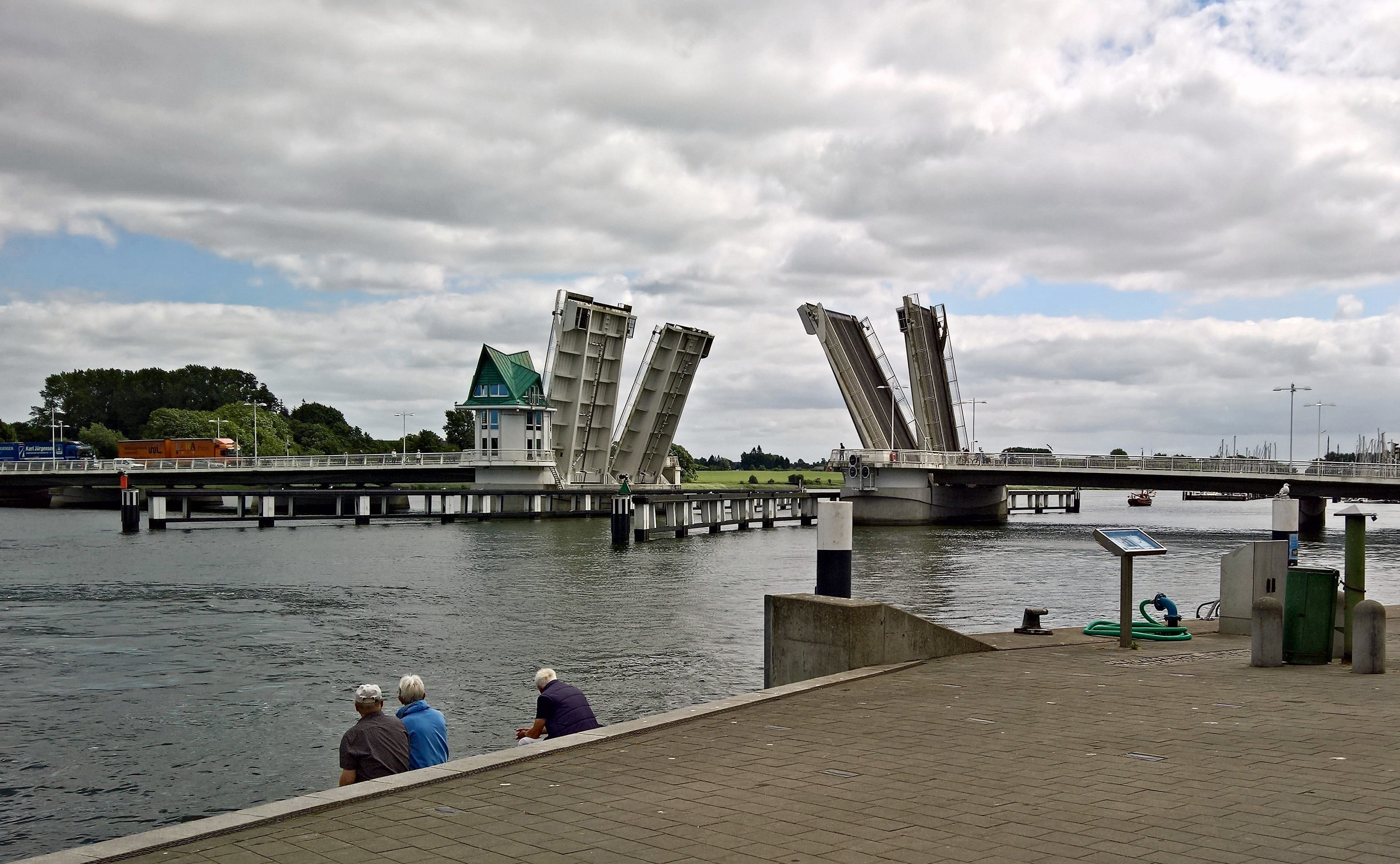 body, northern germany, people, architecture, 2K, adult, kappeln, schlei, sitting, three, cloud - sky, nature, bridge - man made structure, building, bridge, HD Wallpaper