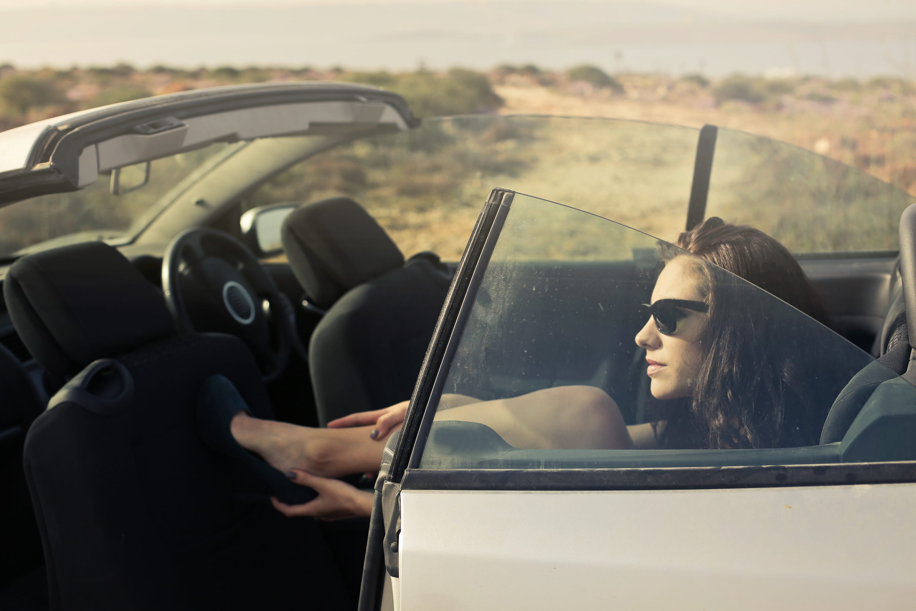 land vehicle, real people, black miniskirt, car, shoes, summer, 2K, sandals, sandal, travel, glasses, black heels, black curly hair, cabrio, women, sunglasses, HD Wallpaper