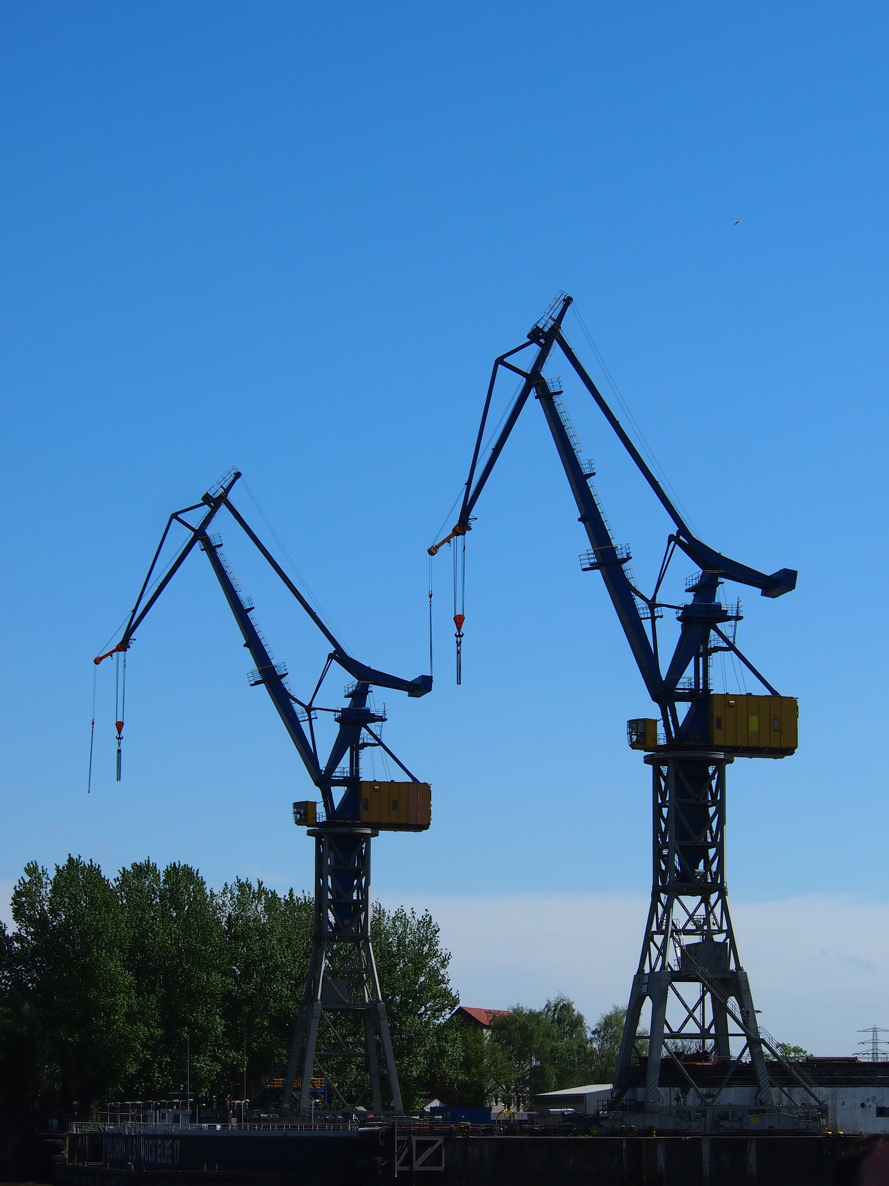 field, outdoors, port, day, crane, nature, germany, construction equipment, industry, oil well, architecture, blue, harbour cranes, metal, development, Phone HD Wallpaper