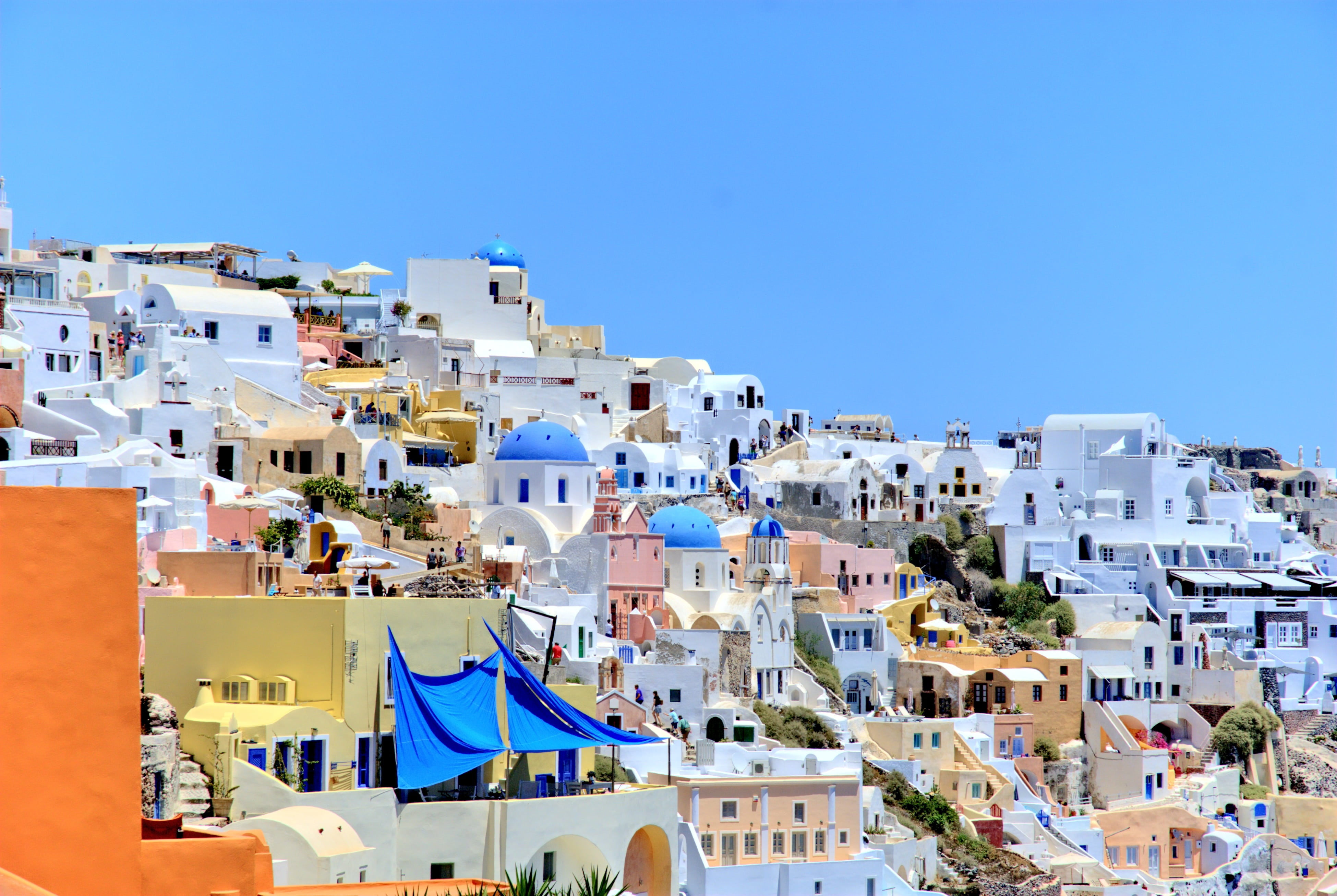 village, famous Place, city, outdoors, holidays, oia, building exterior, blue, nature, built structure, aegean Sea, the coast, water, caldera, 4K, building, HD Wallpaper