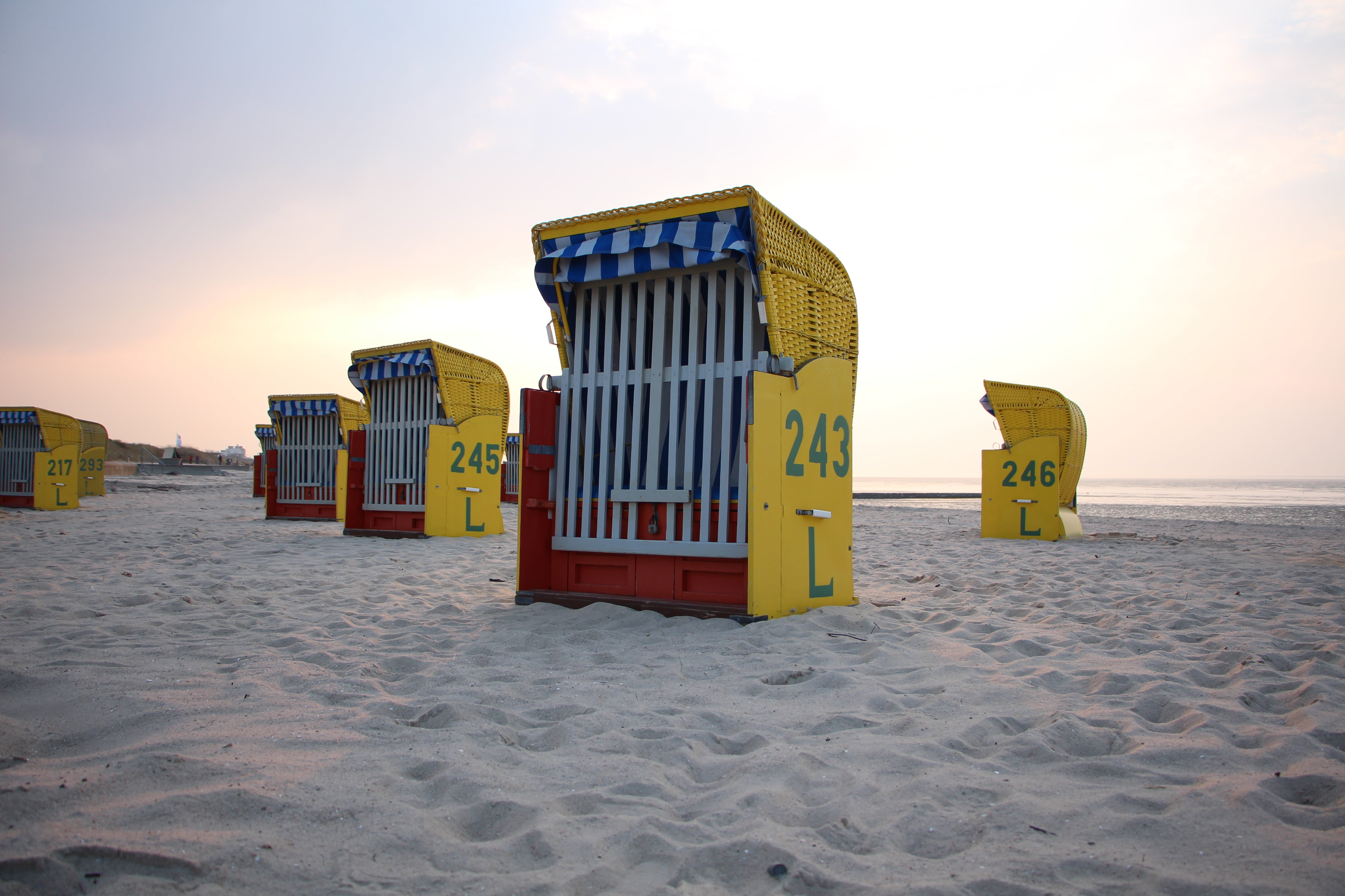 day, tranquility, 5K, outdoors, water, sea, Germany, nature, cloud - sky, no people, sand, hut, architecture, hooded beach chair, beauty in nature, yellow, HD Wallpaper