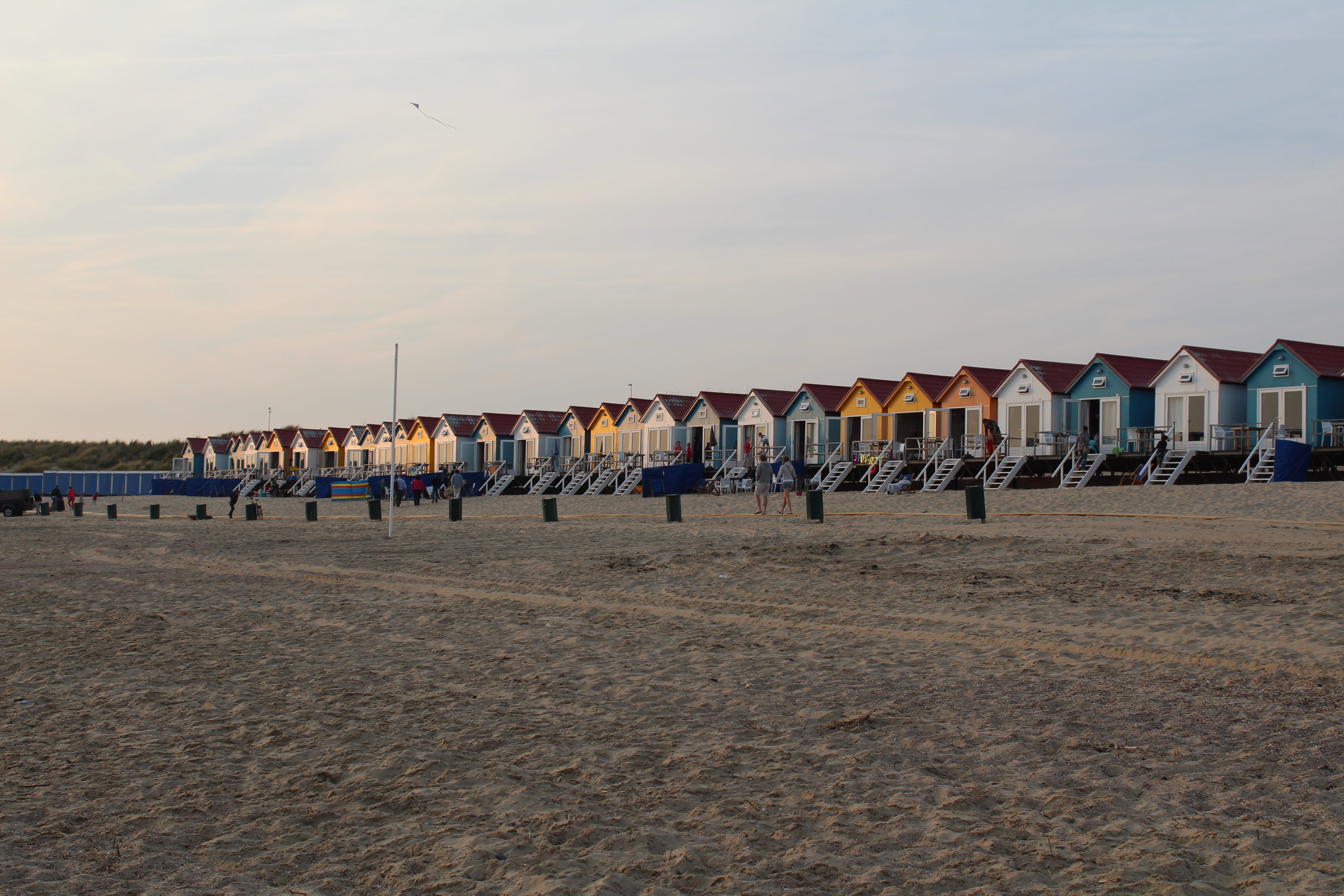 cloud - sky, in a row, sand, sea, crowd, building exterior, real people, built structure, hooded beach chair, colored, beach houses, architecture, sky, HD Wallpaper