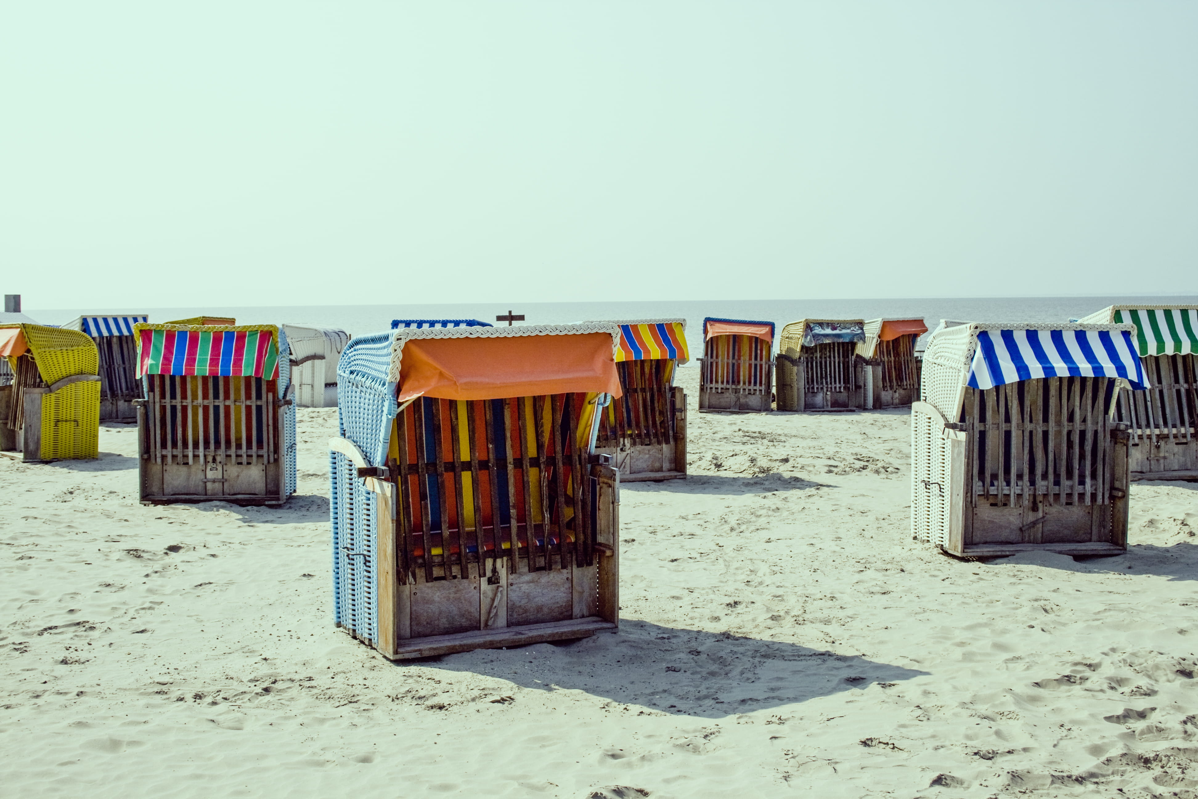 built structure, sunlight, tranquility, sand, shacks, russian, summer, copy space, sky, sea, beach, container, day, architecture, outdoors, clear sky, side by side, HD Wallpaper