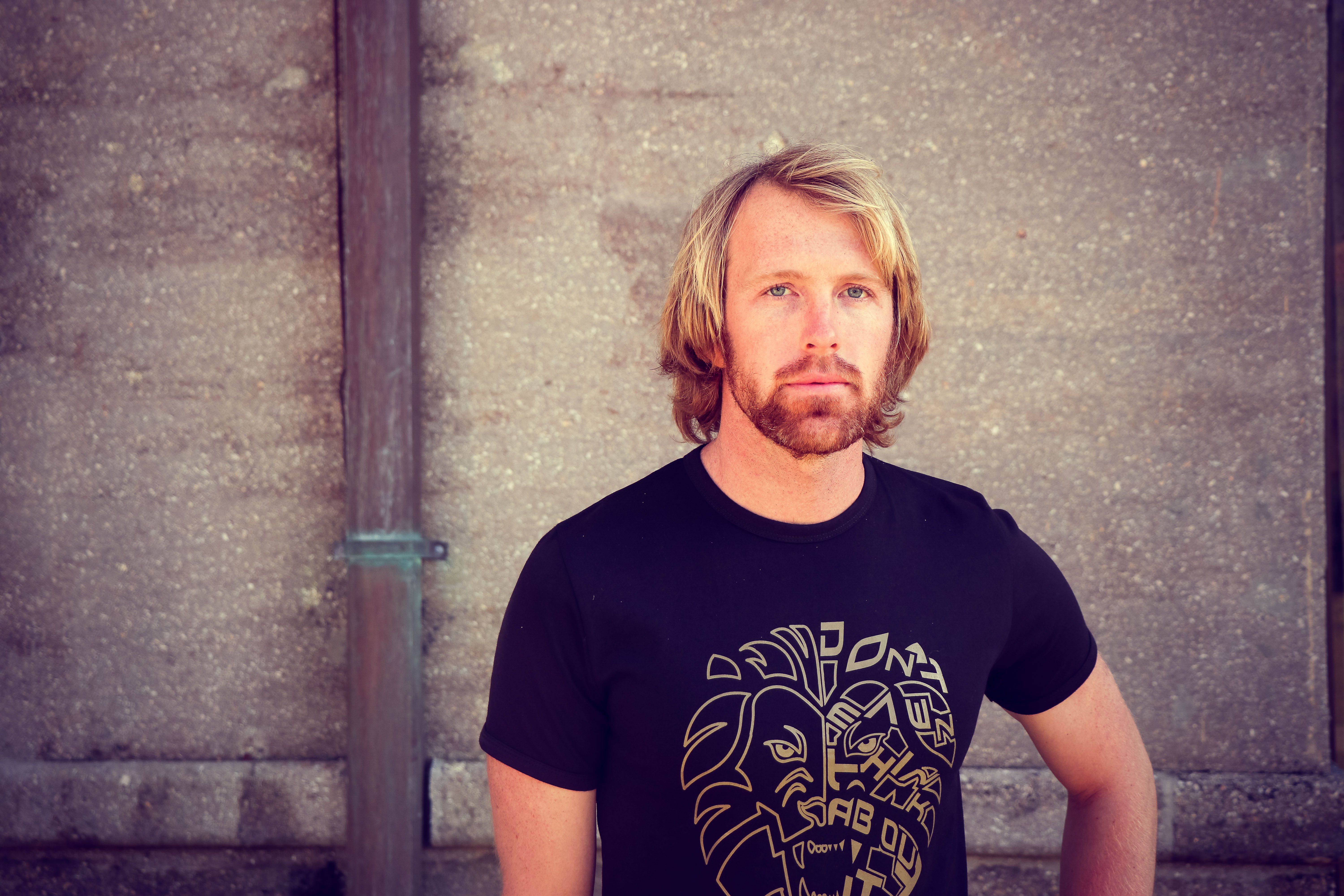 facial hair, head, hipster - person, real people, man, black, shirt, face, serious, wall, neck, contemplation, men, person, male, blond hair, 5K, t, depression - sadness, HD Wallpaper