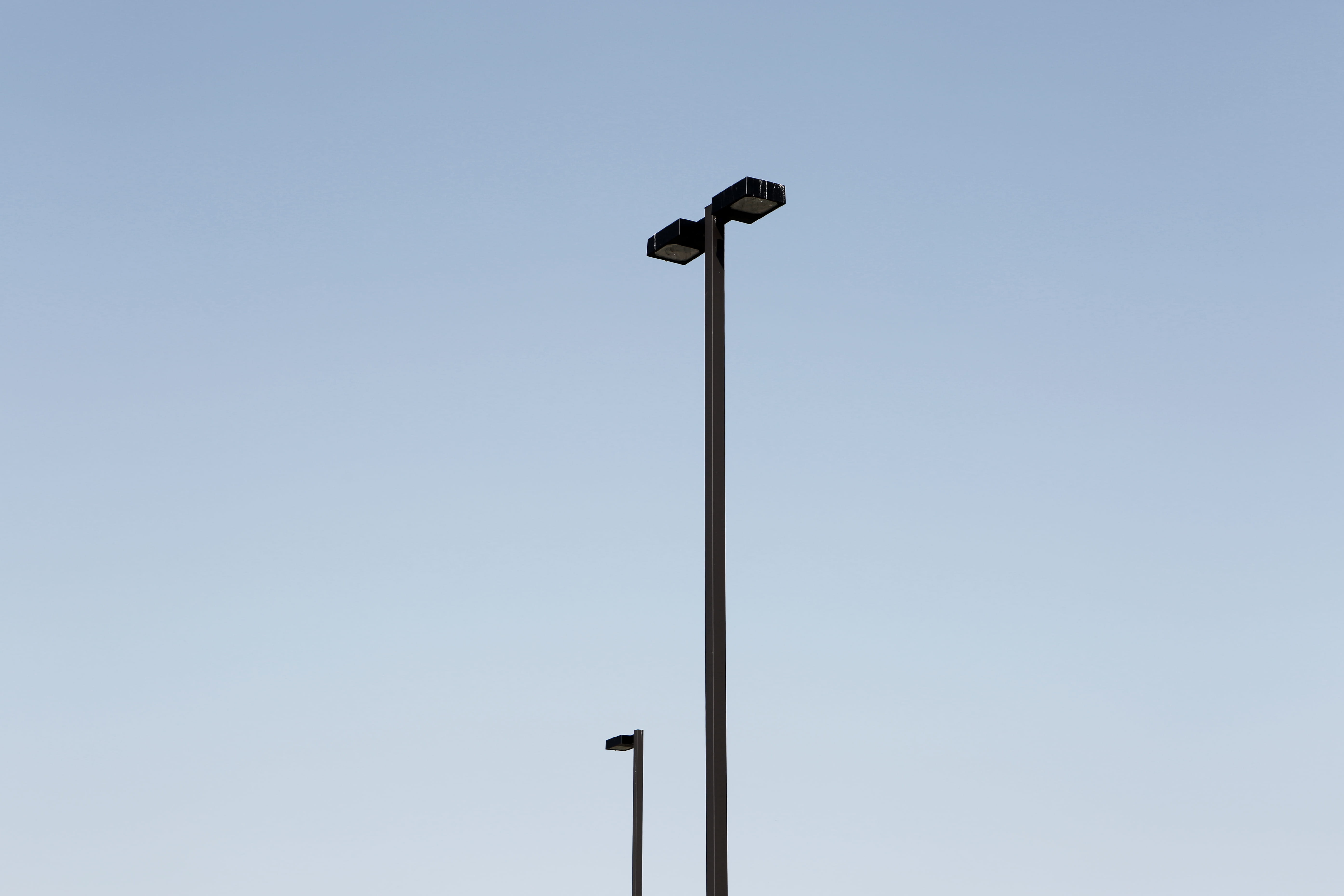 day, electricity, copy space, nature, outdoors, tall, no people, lights, street, poles, 5K, floodlight, low angle view, electric light, surveillance, technology, HD Wallpaper