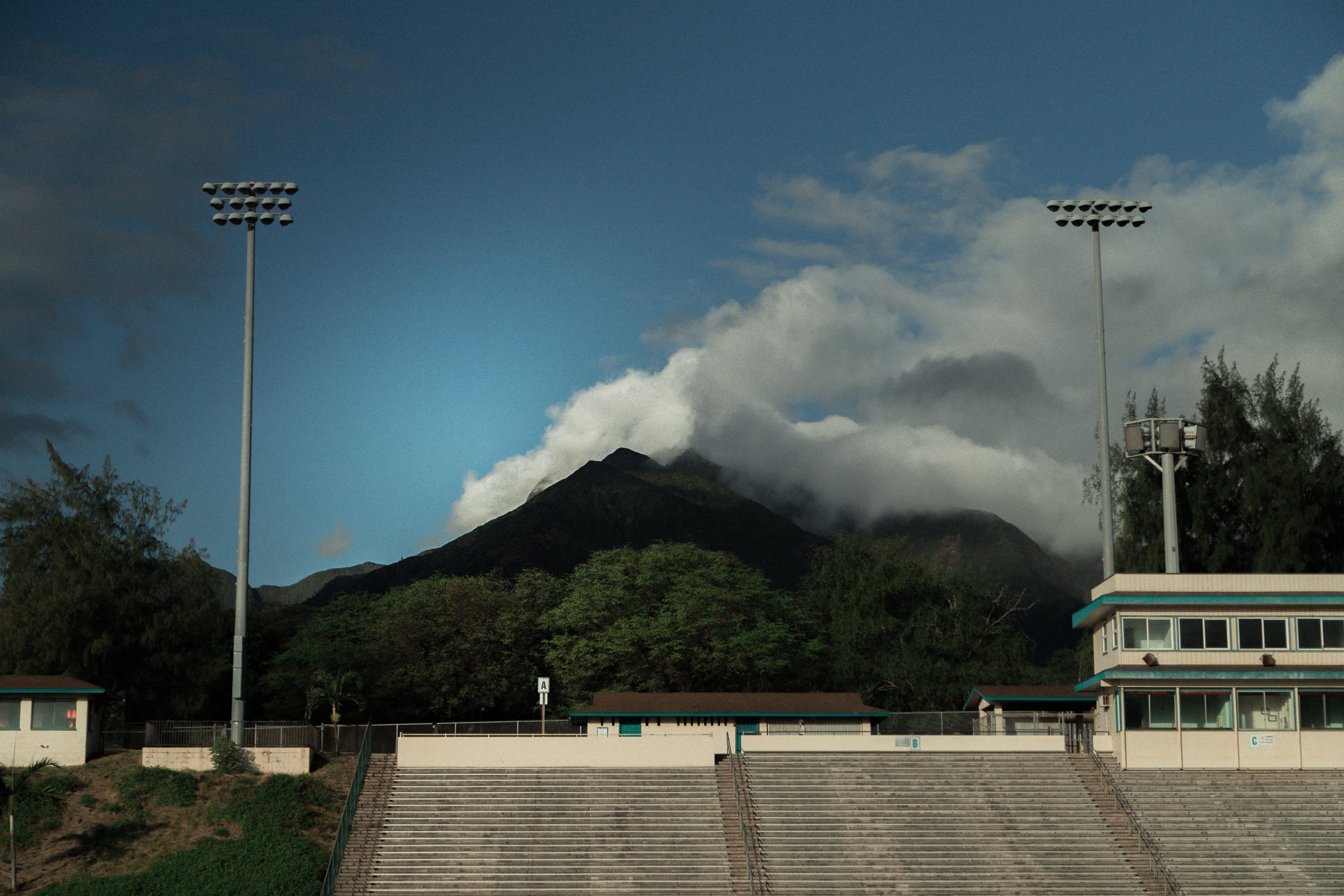 outdoors, mountain, built structure, transportation, cloud - sky, sky, building exterior, 5K, floodlight, foliage, sport, football, blowing, field, daytime, HD Wallpaper