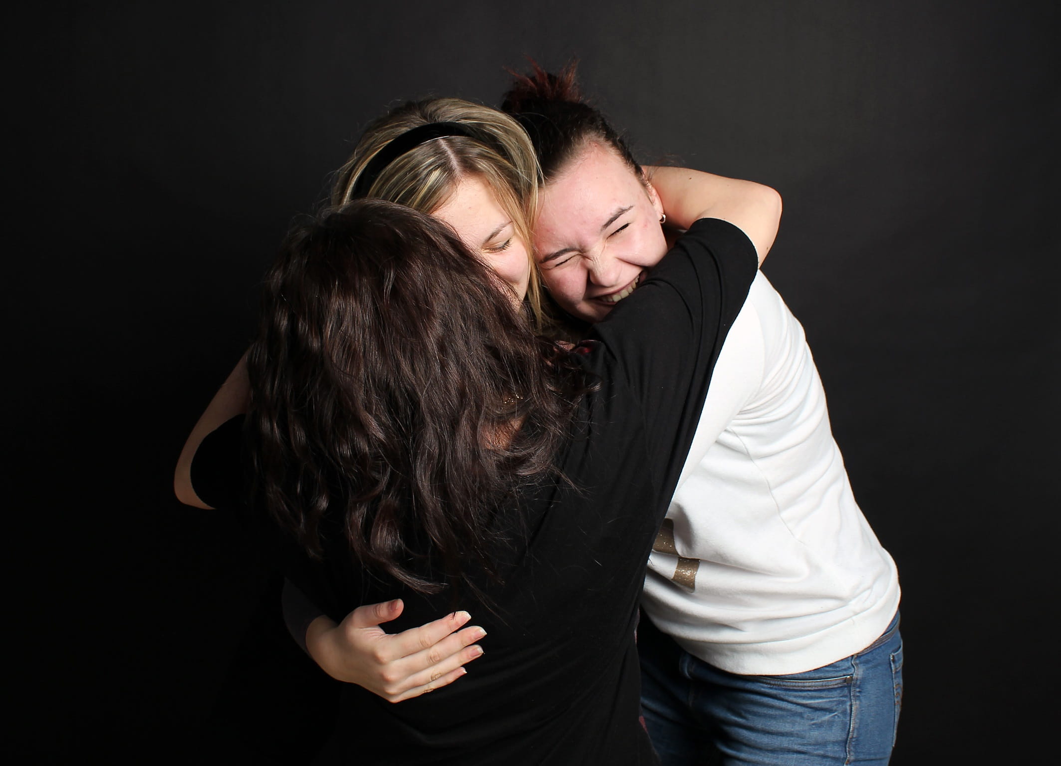 young adult, studio shot, three, togetherness, embracing, young women, 1080P, bonding, girls, adult, heterosexual couple, black background, hairstyle, HD Wallpaper