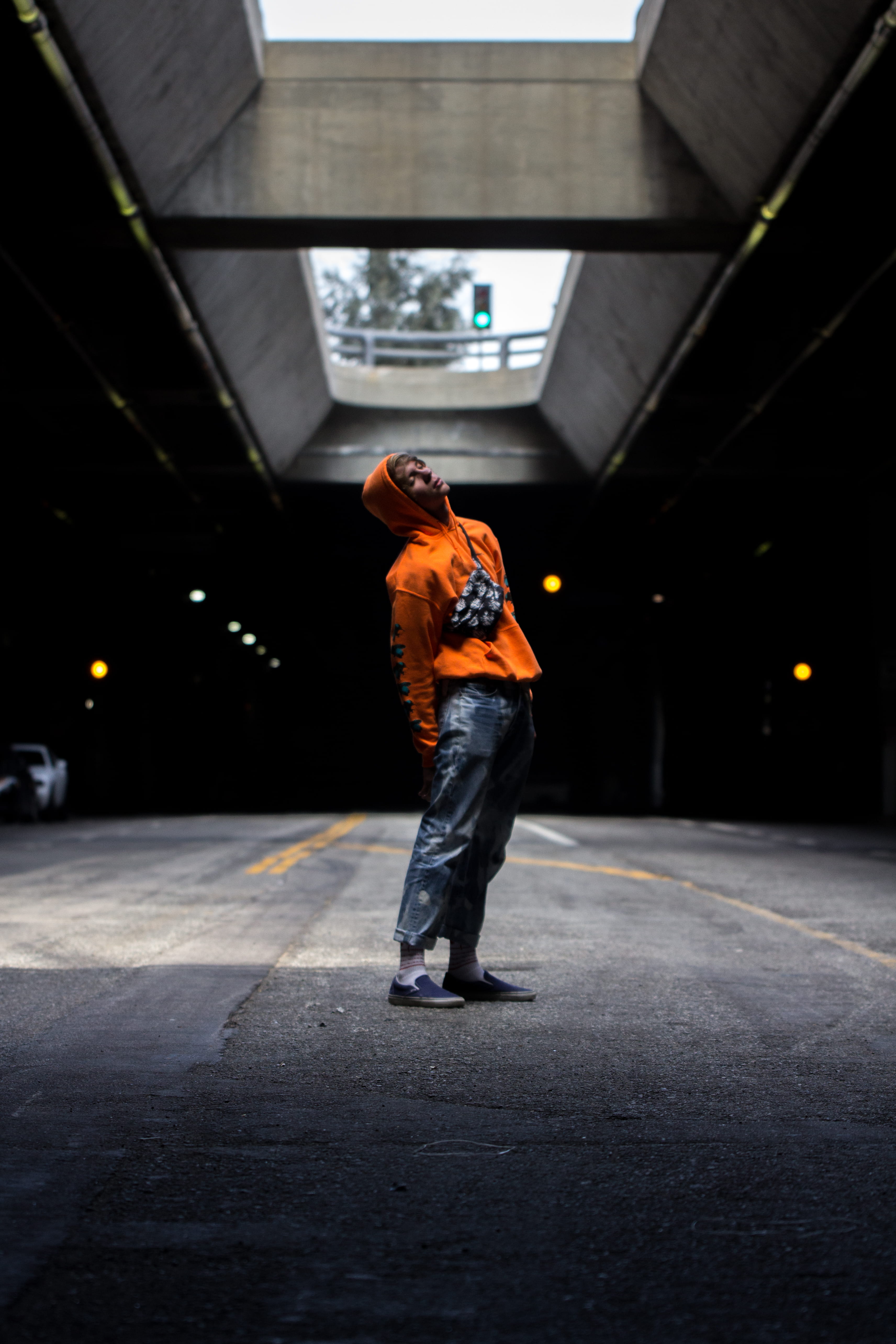 hoodie, orange hoodie, road, full length, pose, jeans, person, casual clothing, mystic, black, illuminated, one person, light, sign, men, lifestyles, lot, Phone HD Wallpaper