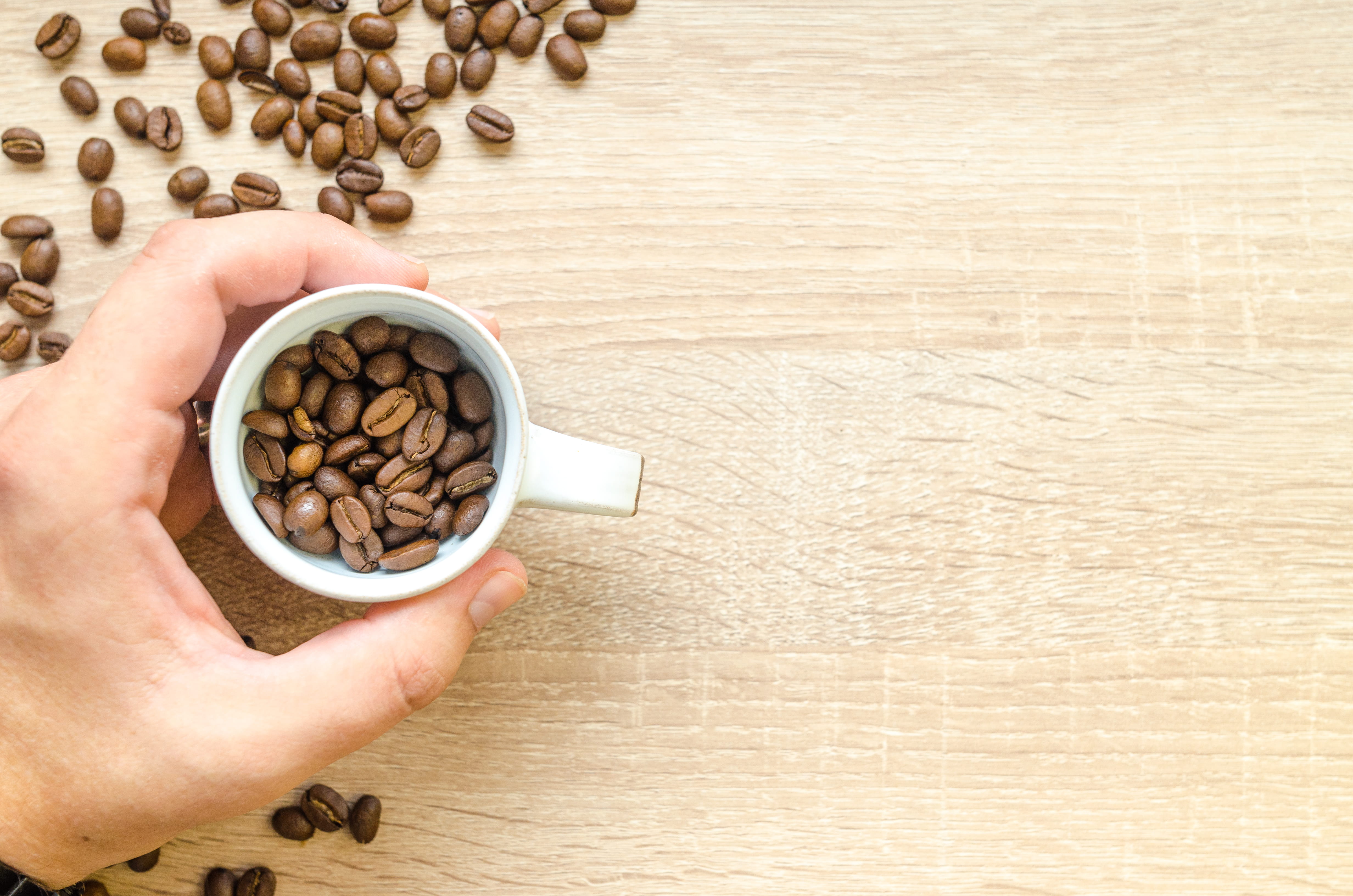 top view, coffee, wooden, aromatic, hold, body part, cup, close-up, coffee beans, drink, real people, roasted coffee bean, 4K, non-alcoholic beverage, HD Wallpaper