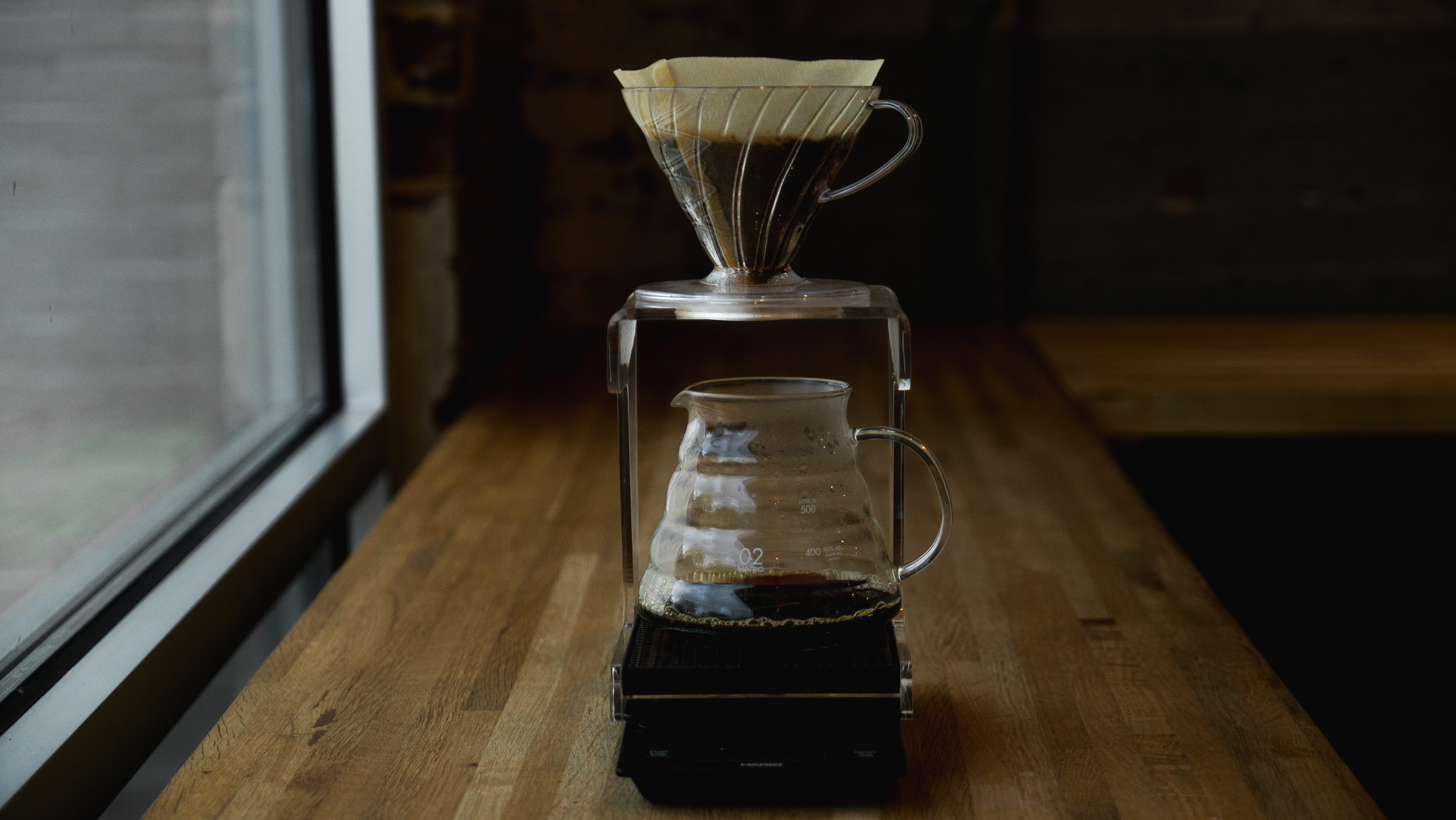 simplistic, hand, airtight, filter coffee, 5K, table, close-up, Coffee, transparent, no People, old, bottle, coffee brewing, hario, minimalistic, domestic room, HD Wallpaper