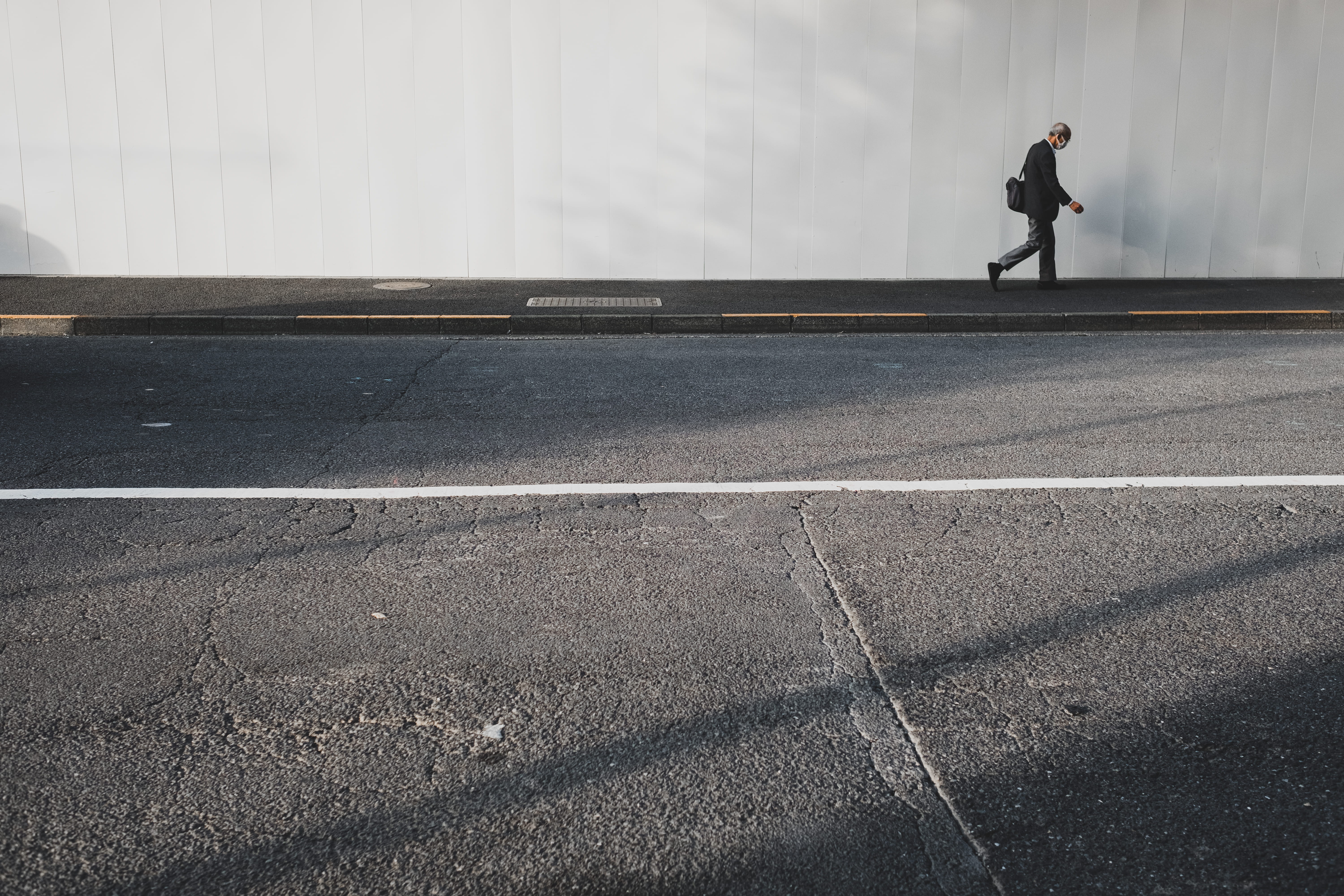urban, marking, white, person, symbol, man, 5K, sign, sunlight, outdoors, casual clothing, full length, street, walk, walking, road, day, real people, HD Wallpaper