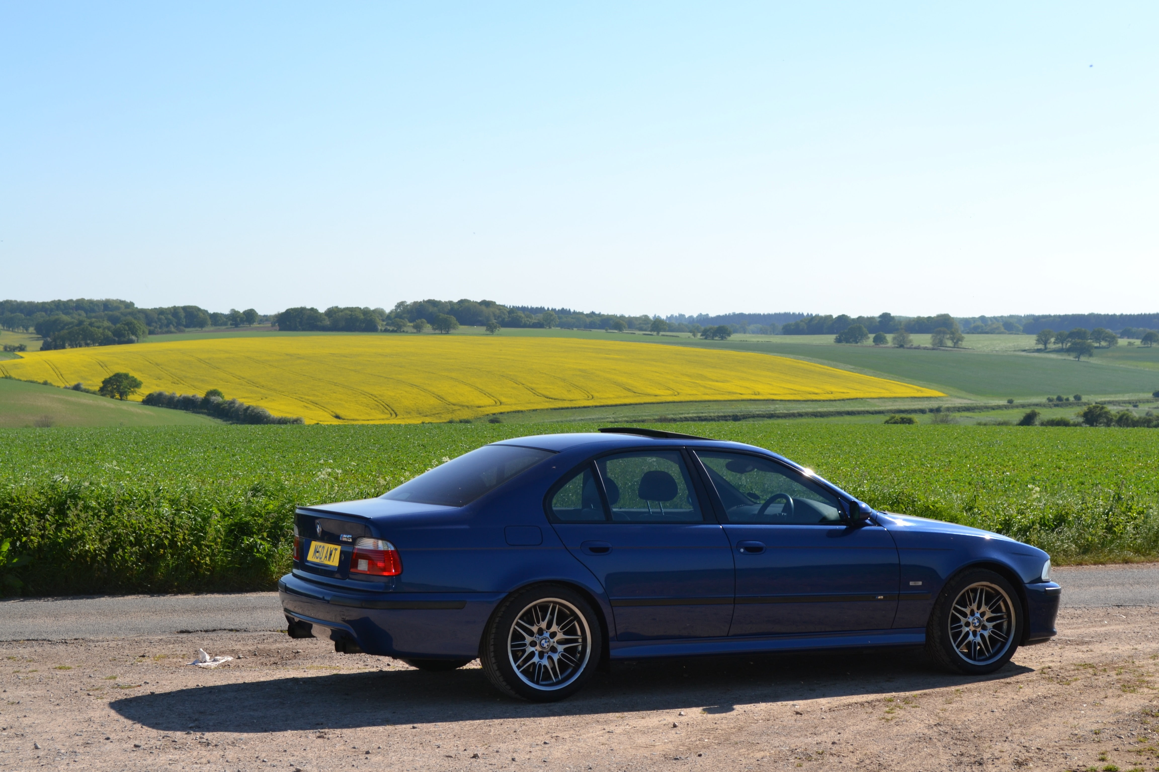 day, motor vehicle, 4K, land, grass, land vehicle, transportation, road trip, sky, copy space, no people, rural scene, clear sky, field, car, environment, HD Wallpaper