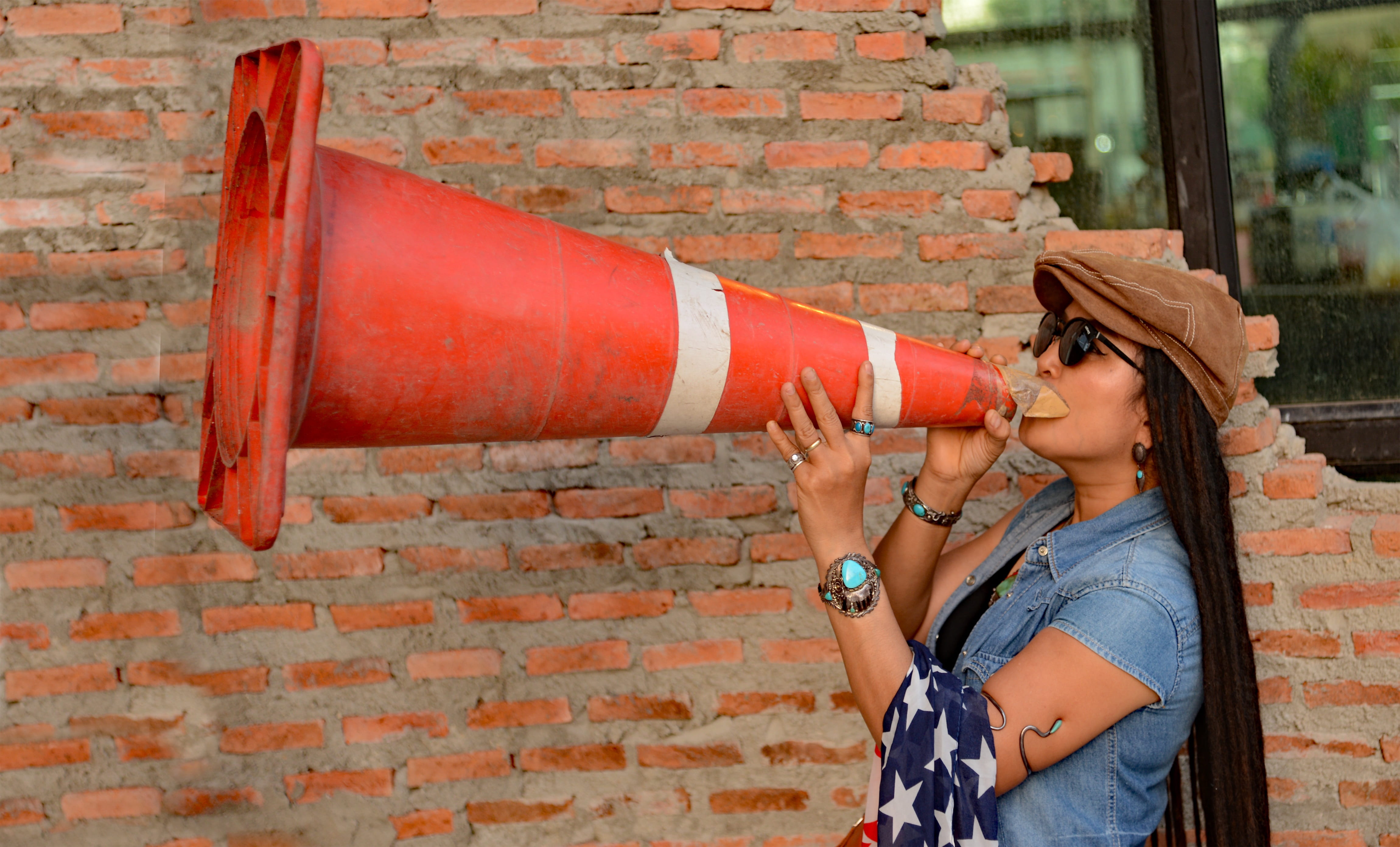 red, brick wall, cone, Instructor, leisure activity, wall - building feature, real people, lifestyles, hairstyle, loudhailer, young adult, Megaphone, brick, HD Wallpaper