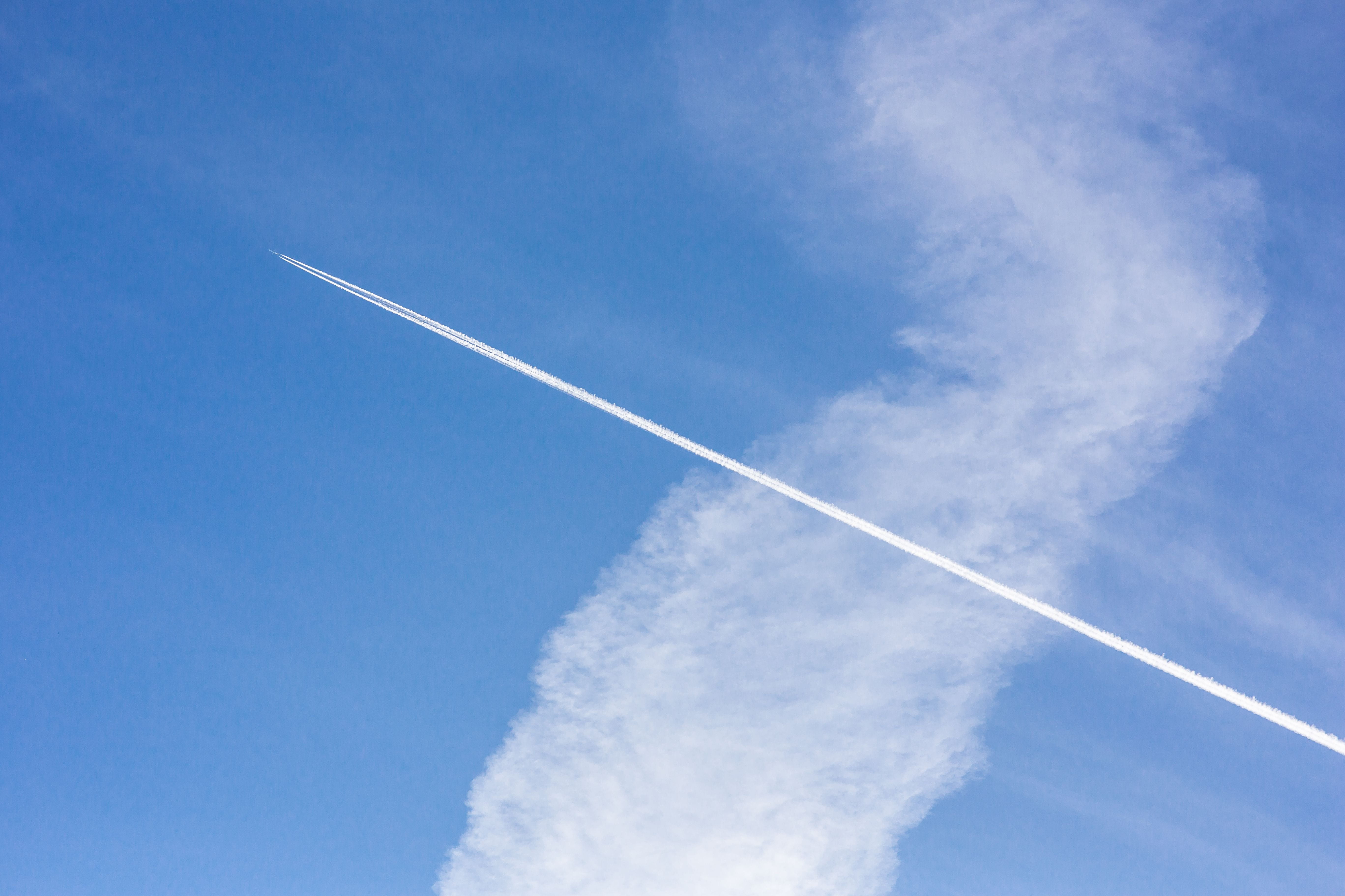 smoke - physical structure, contrail, airplane, low angle view, flying, nature, weather, outdoors, sky, travel, on the move, Cloudy, air, cloud - Sky, cloud, HD Wallpaper