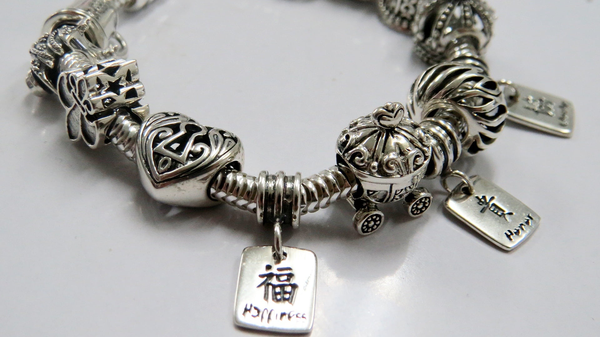 western script, antique, still life, hanging, safety, personal accessory, close-up, protection, focus on foreground, silver bracelet, key, oxidized beads, HD Wallpaper