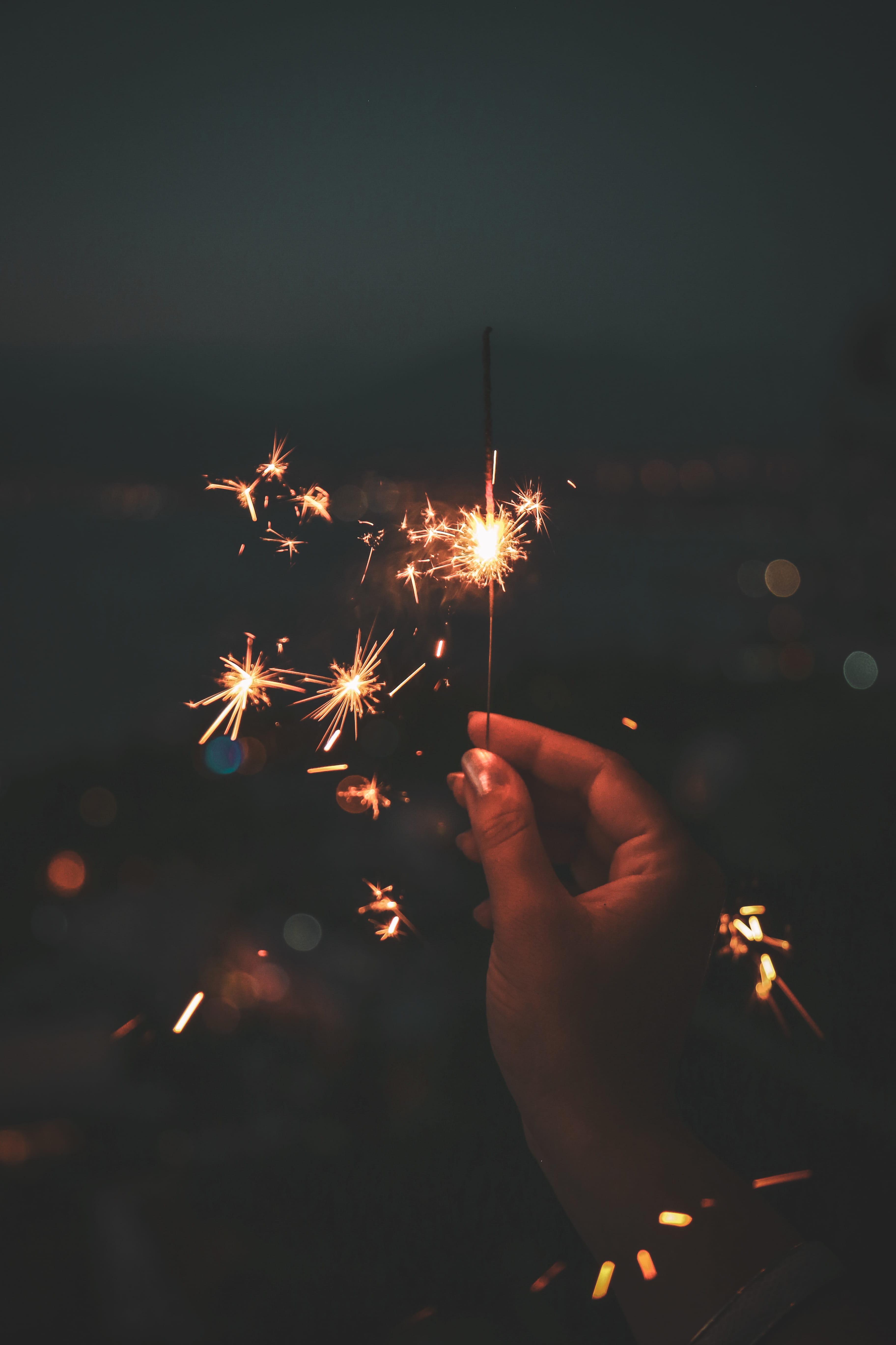 event, burning, exploding, real people, illuminated, finger, motion, human hand, holding, firework - man made object, glowing, fire, night, dark, firework, Phone HD Wallpaper