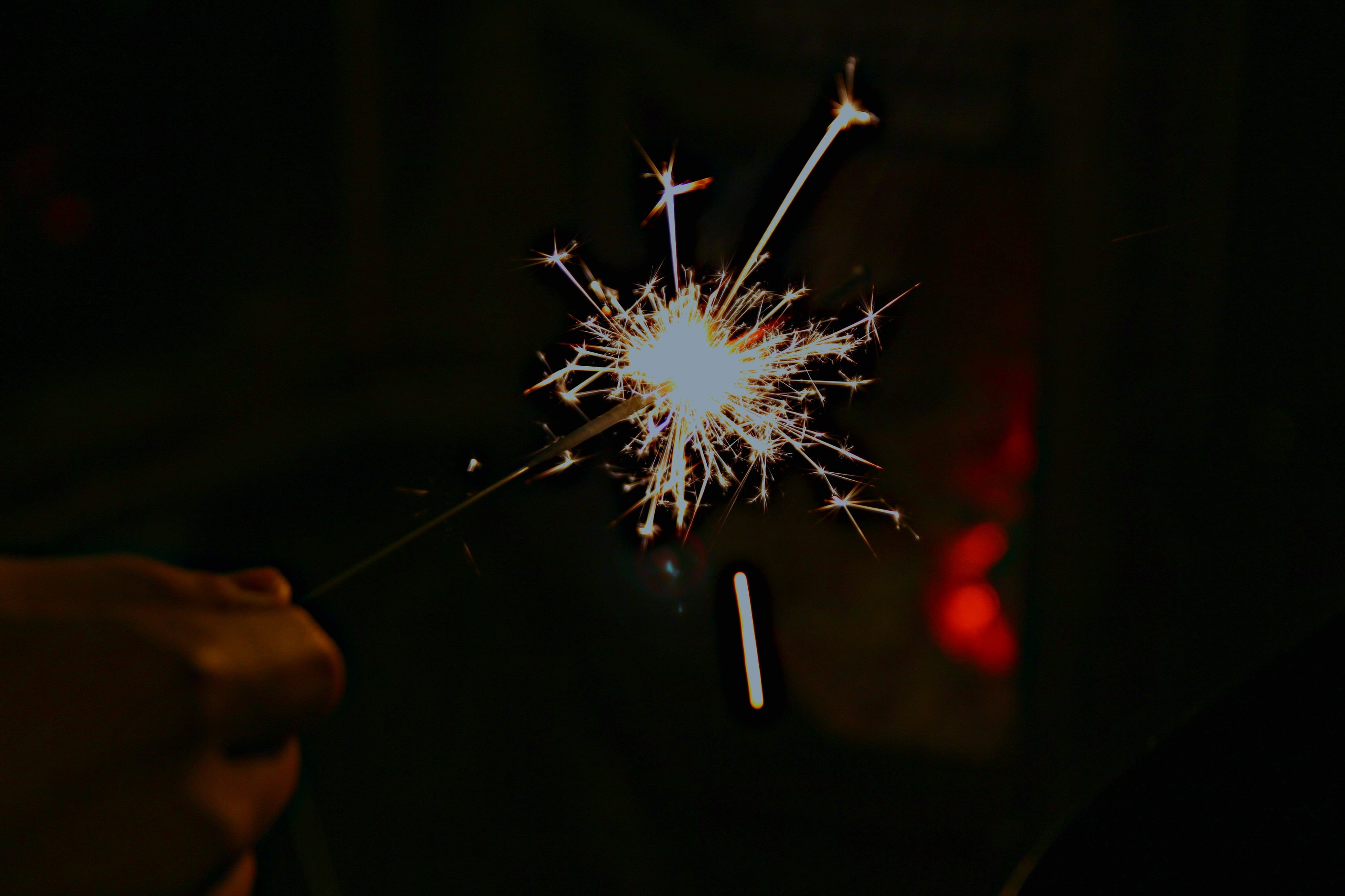 burning, sparkler, human body part, arts culture and entertainment, one person, firework, glitter, hand, blurred motion, illuminated, firework display, HD Wallpaper