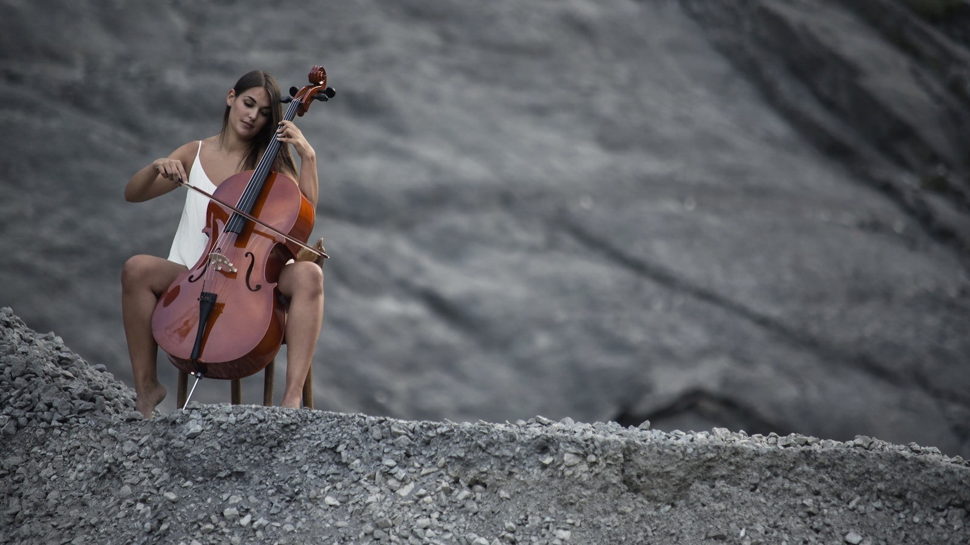 women outdoors, white clothing, 1080P, nature, brunette, model, hills, barefoot, playing, stones, sitting, women, contrabass, music, spread legs, long hair, HD Wallpaper