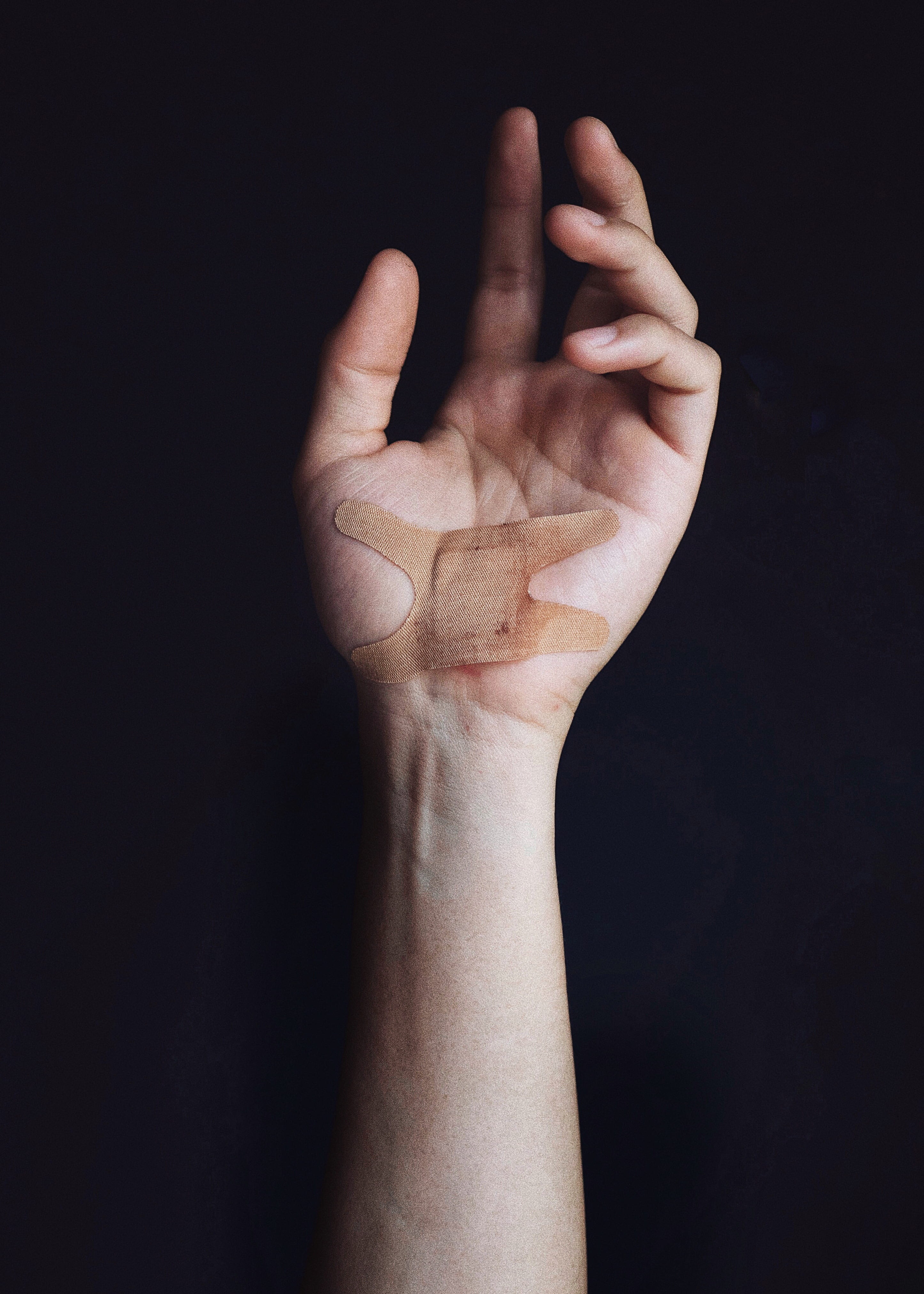 bandage, feeling, adult, palm, hand sign, finger, black background, bandaid, human body part, communication, wound, wearing, feel, studio shot, hand, band, Phone HD Wallpaper