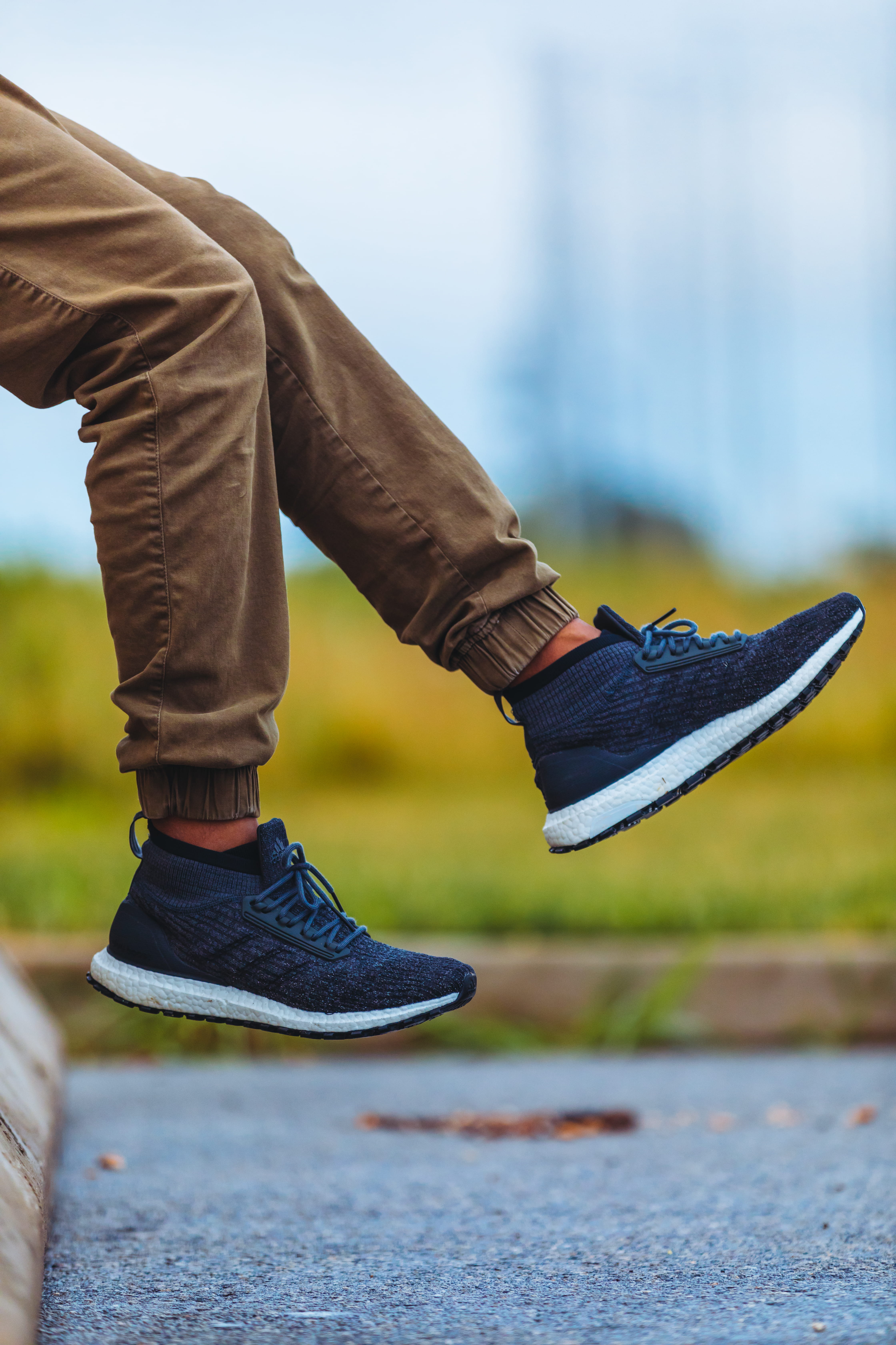 jeans, selective focus, pants, human leg, focus on foreground, brown, daytime, blue, adidas, men, human foot, sole of shoe, lifestyles, side view, human limb, Phone HD Wallpaper