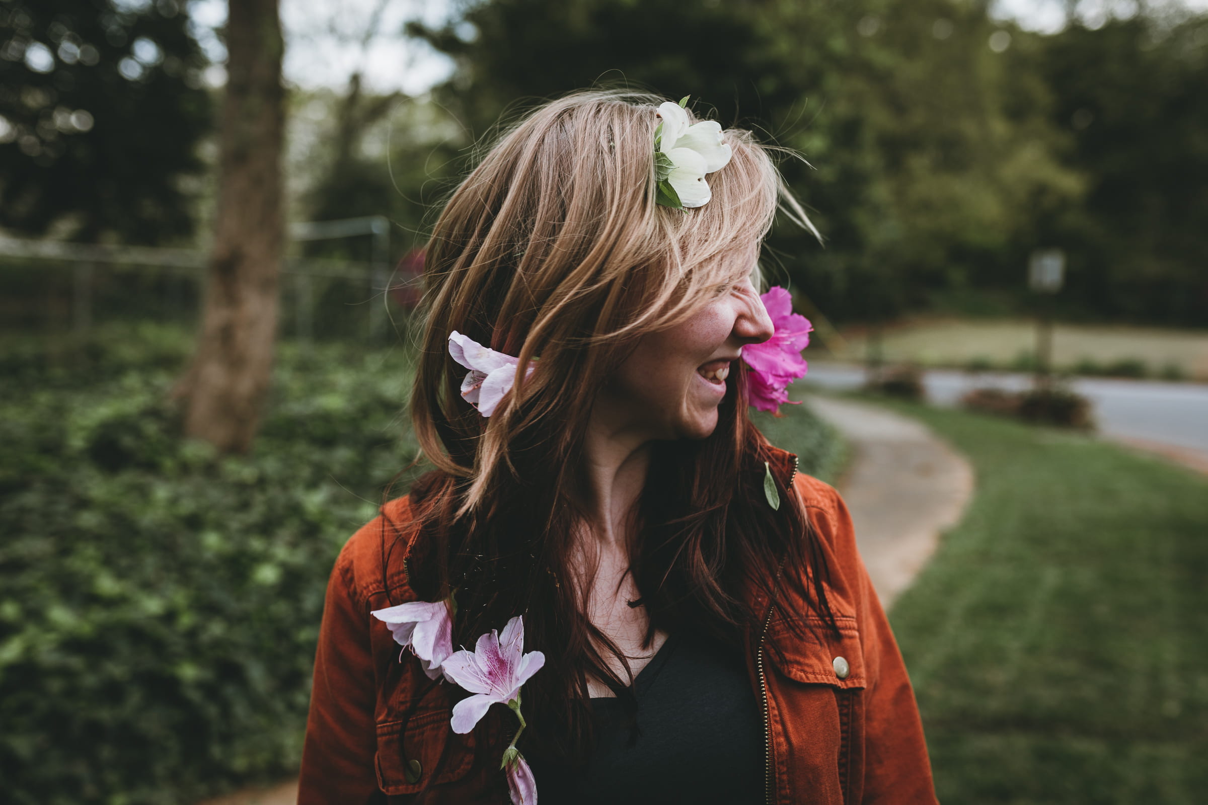 long hair, woman, city, wearing flowers, left, detail, near, smile, standing, women, portrait, bokeh, path, daytime, young adult, flower, headshot, hair, HD Wallpaper