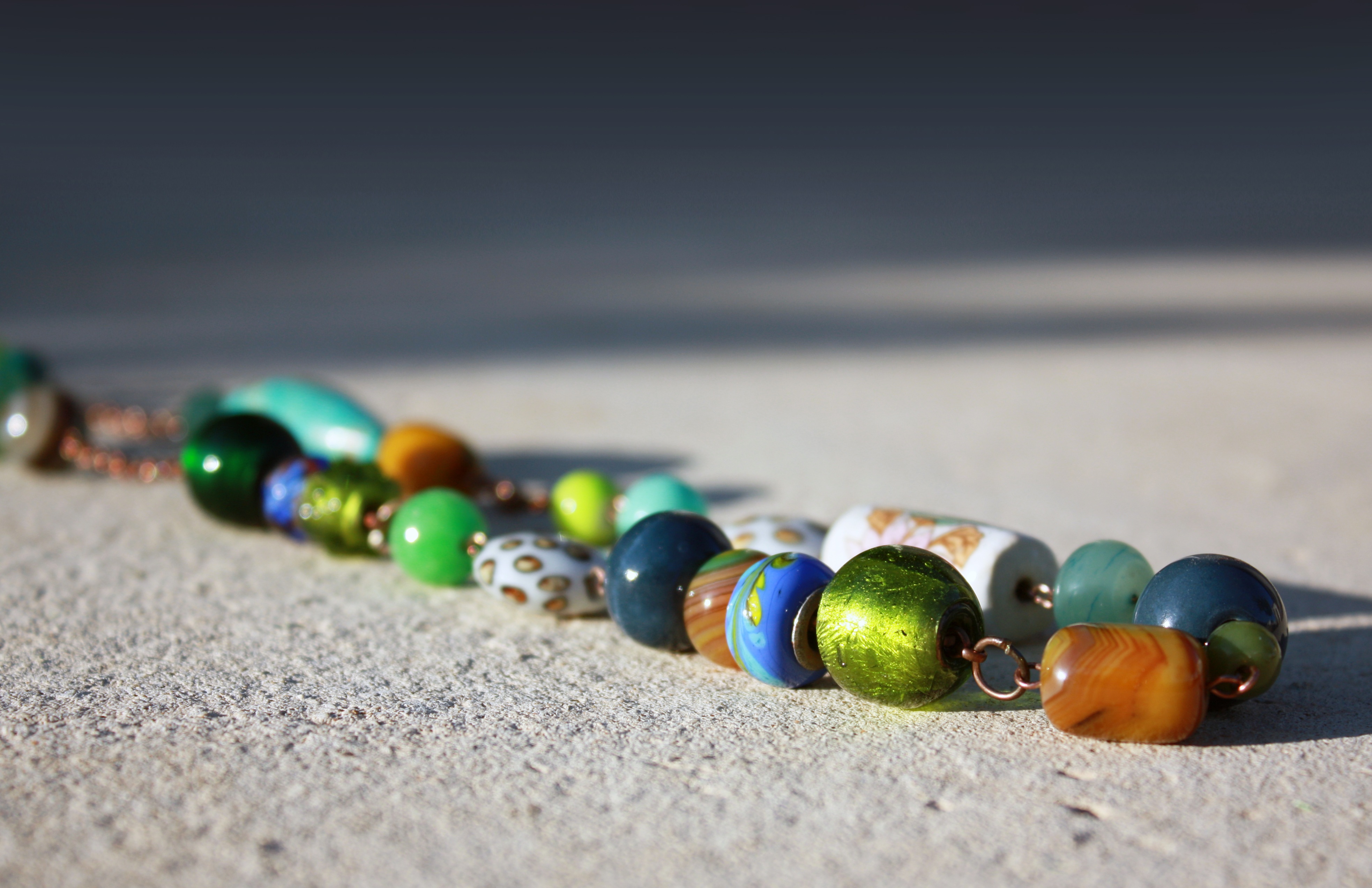 table, sphere, variation, green color, land, day, beach, multicolored, gemstone, decoration, blue, fashion jewellery, ornament, no people, green, copy space, HD Wallpaper