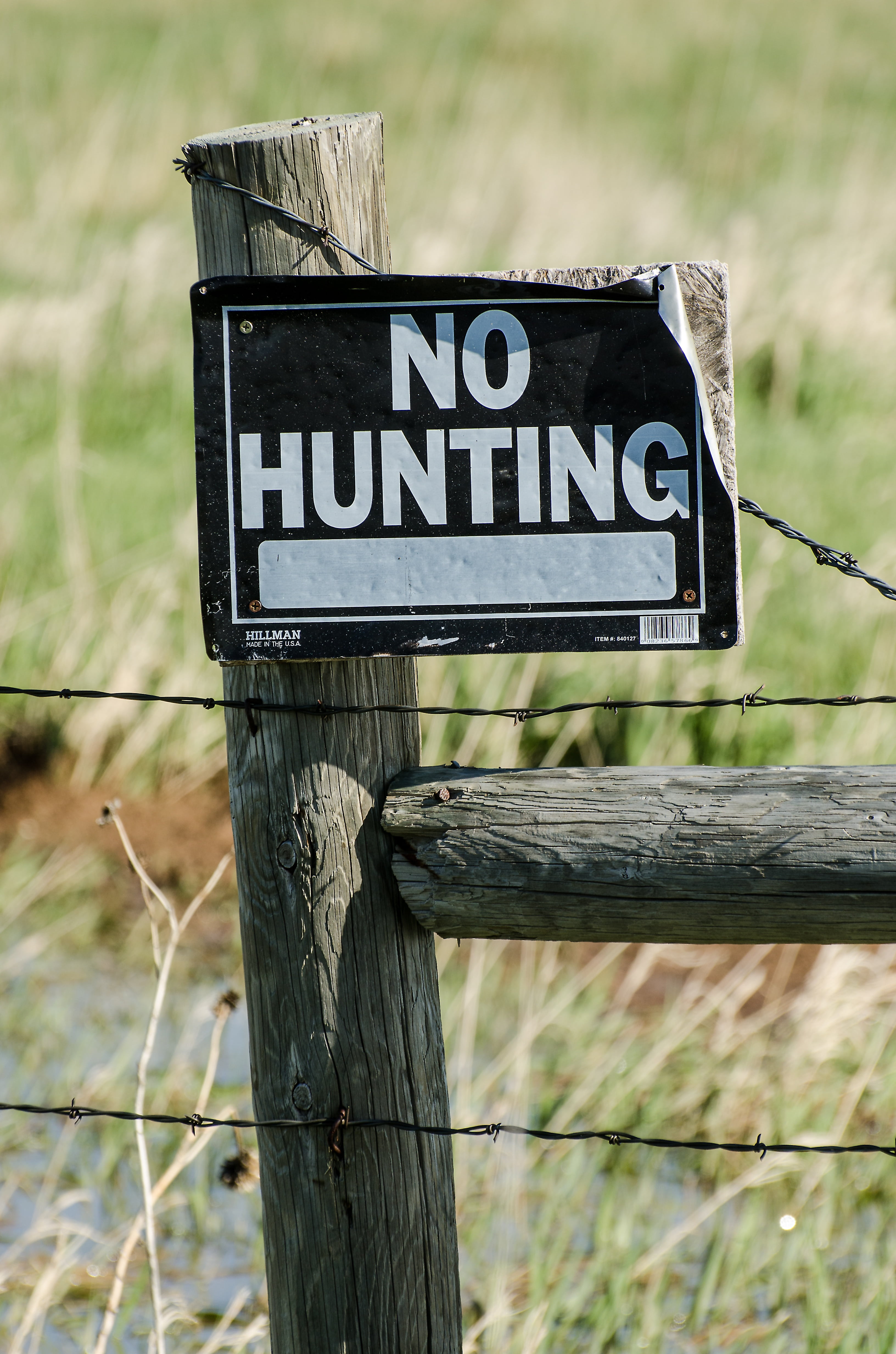 no hunting, signage, wood - material, danger, capital letter, no hunting sign, nature, day, brown, guidance, barbed wire, wooden post, tattered, no people, Phone HD Wallpaper