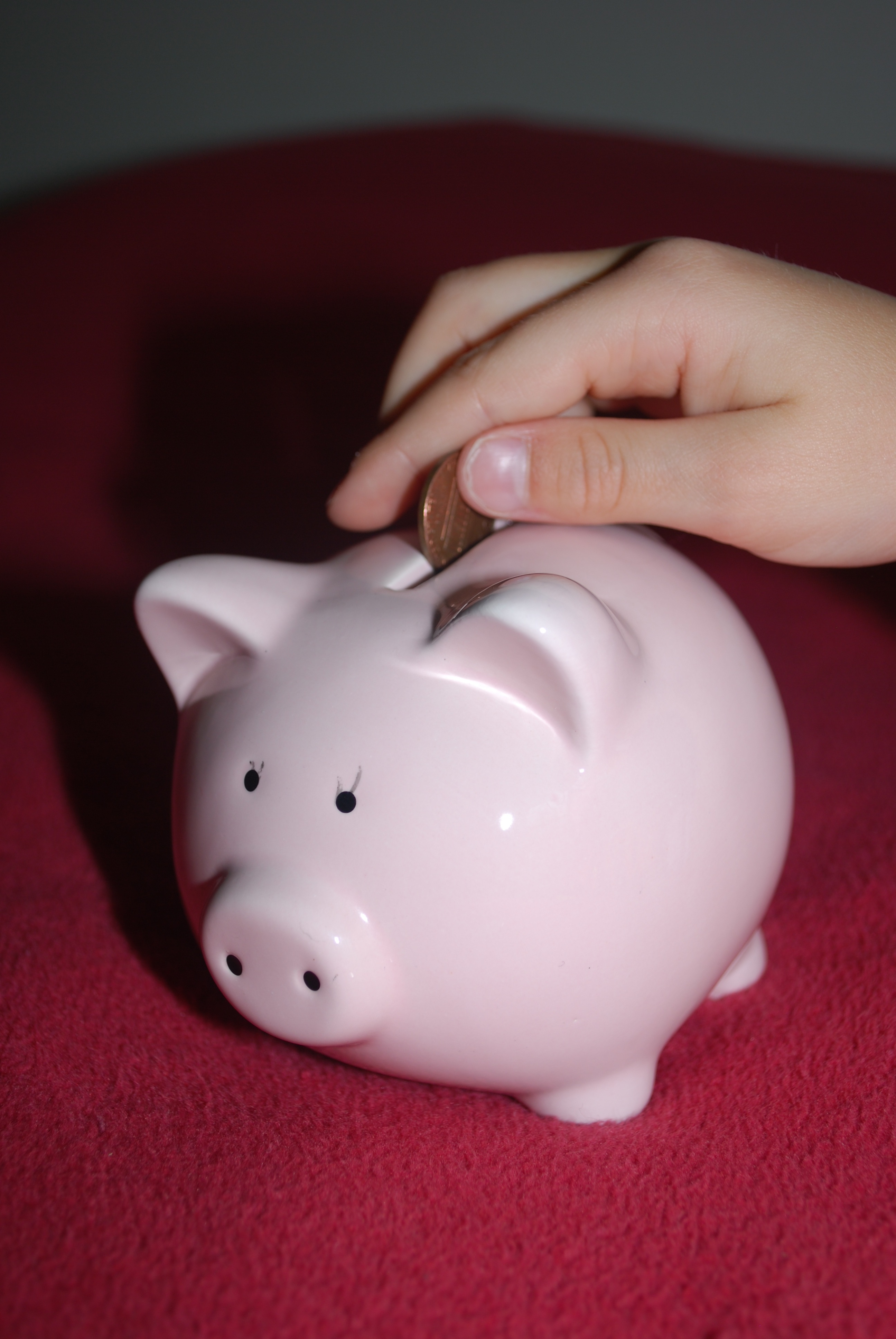 real people, human hand, piggy Bank, coin, pink, bank, human body part, inserting, 4K, holding, red, human finger, table, currency, piggy, savings, body part, Phone HD Wallpaper