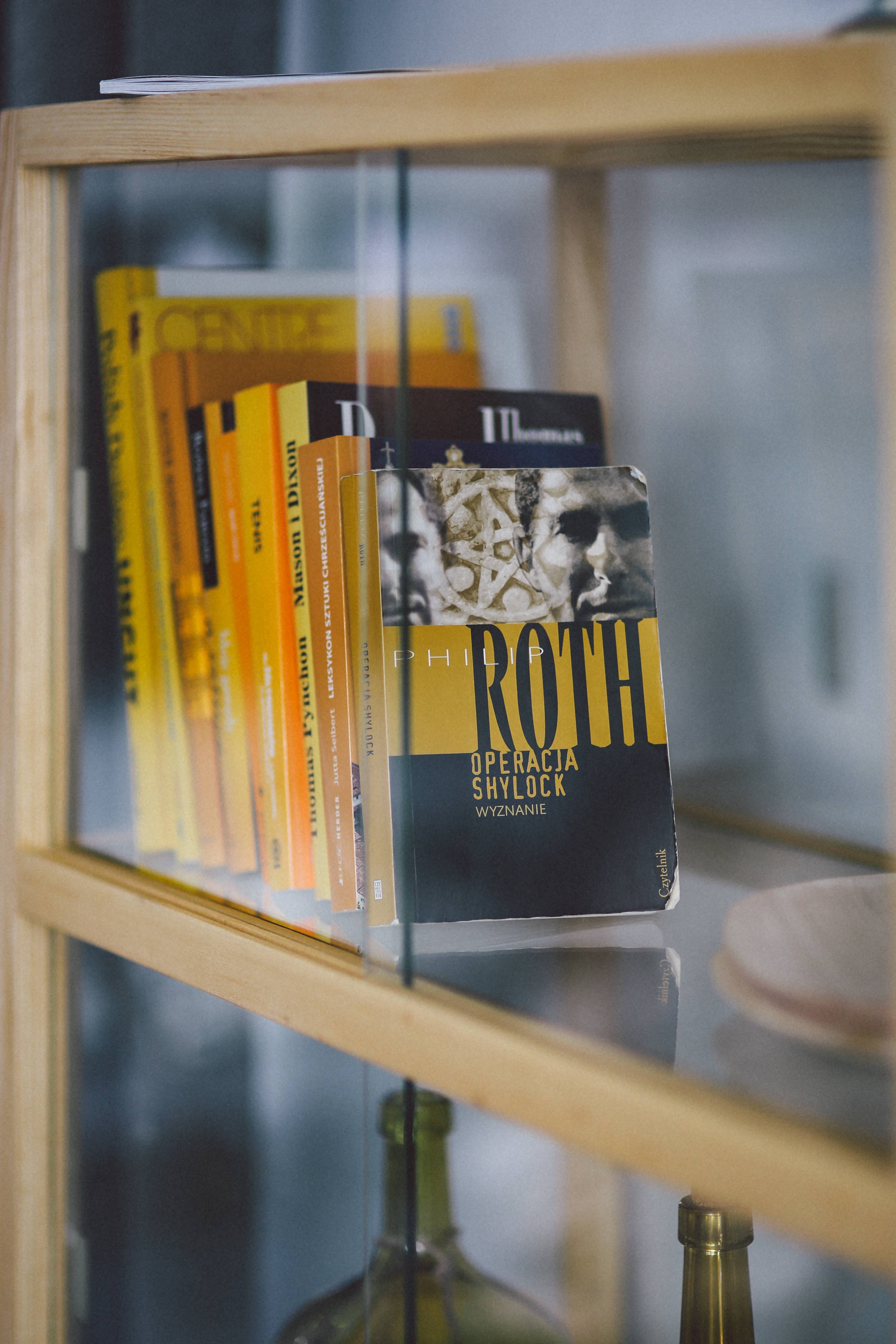 western script, capital letter, bookcase, text, bookshelf, close-up, Books, sign, selective focus, glass - material, day, no people, still life, focus on foreground, Phone HD Wallpaper