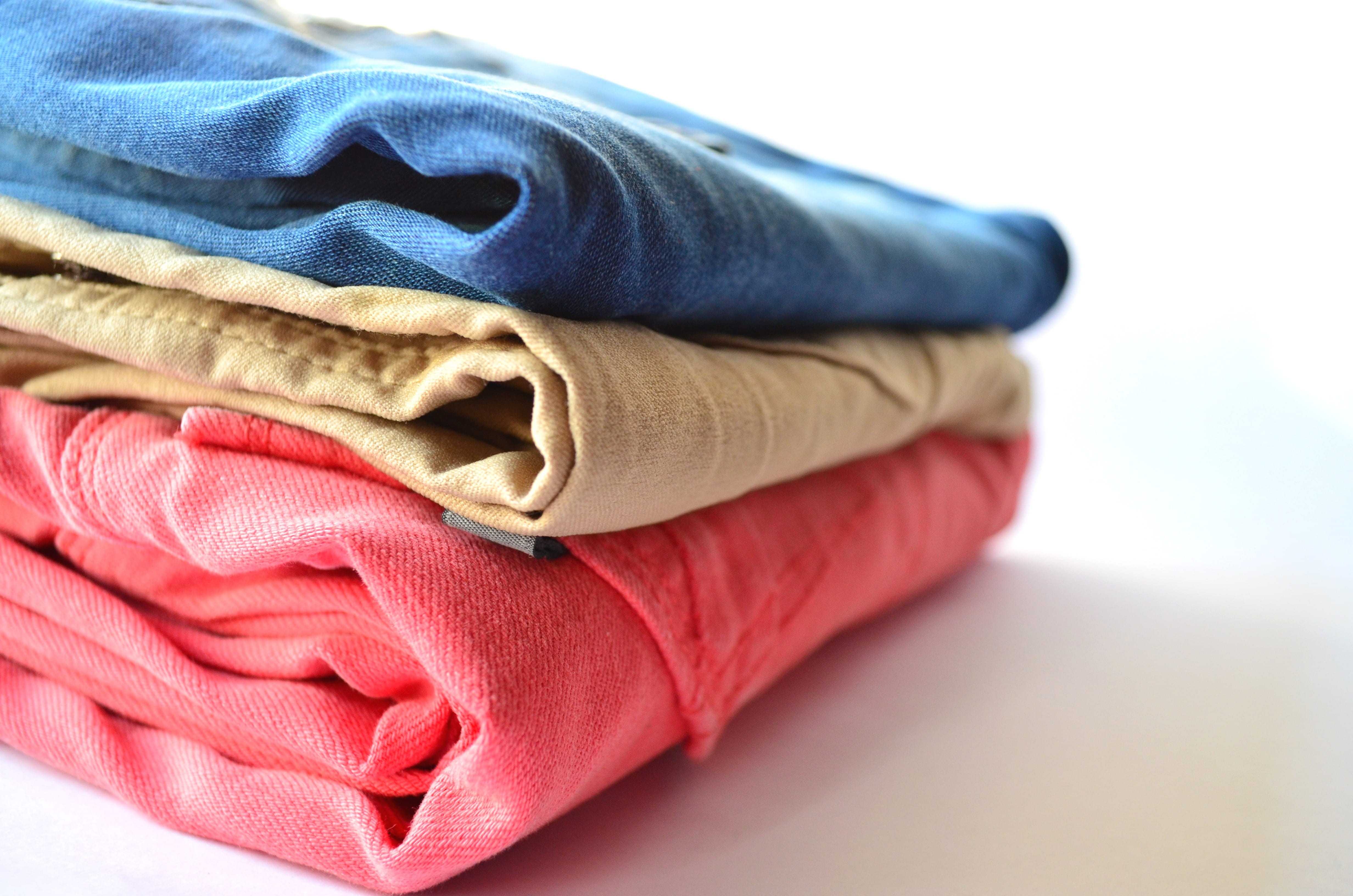 stack, studio shot, multi colored, towel, trousers, no people, red, softness, group of objects, fashion, folded, white background, indoors, pants, laundry, HD Wallpaper