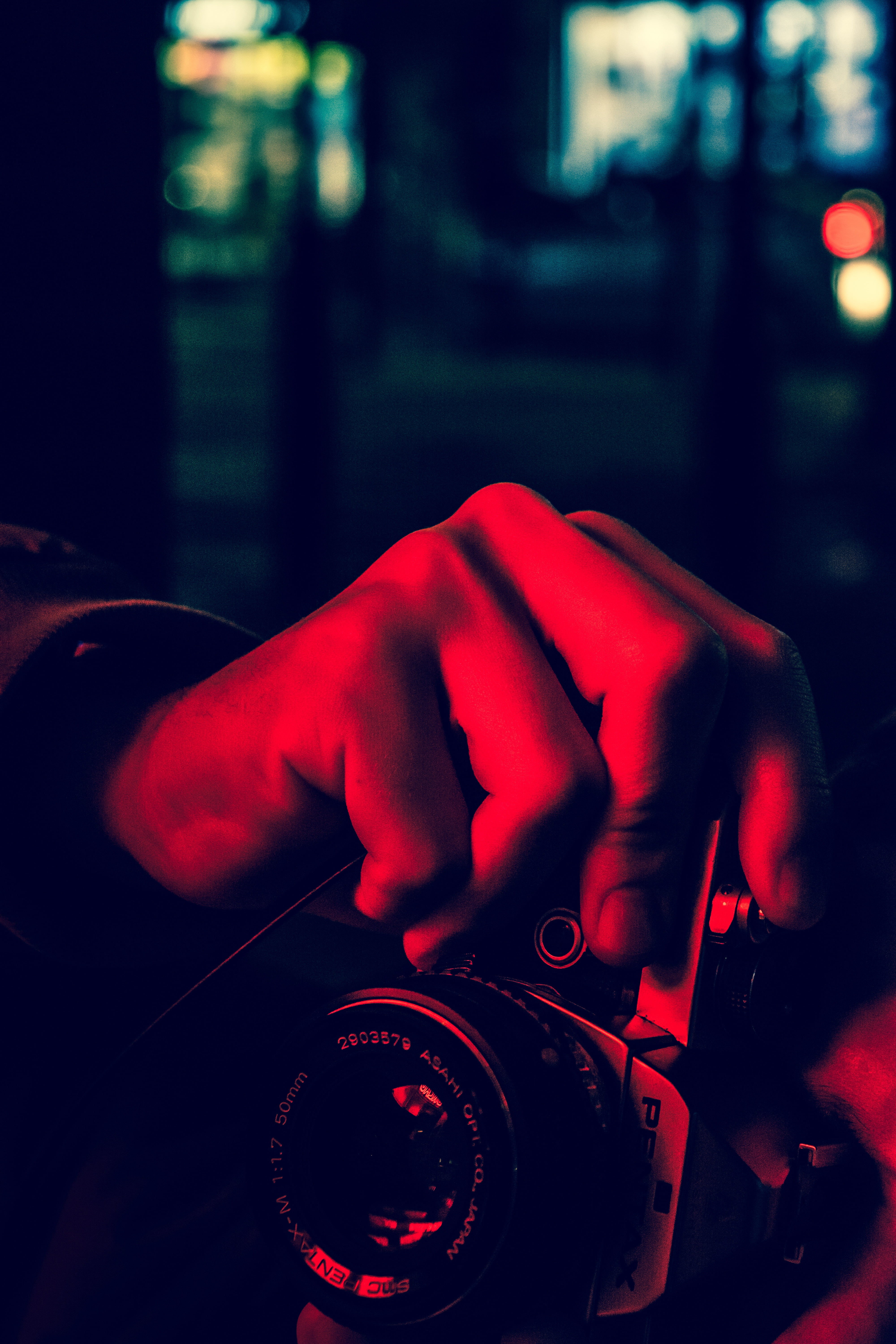 person, nightlife, photography, dark, close-up, motor vehicle, photographer, focus on foreground, hand, camera, Pentax, illuminated, human hand, red, car, Phone HD Wallpaper