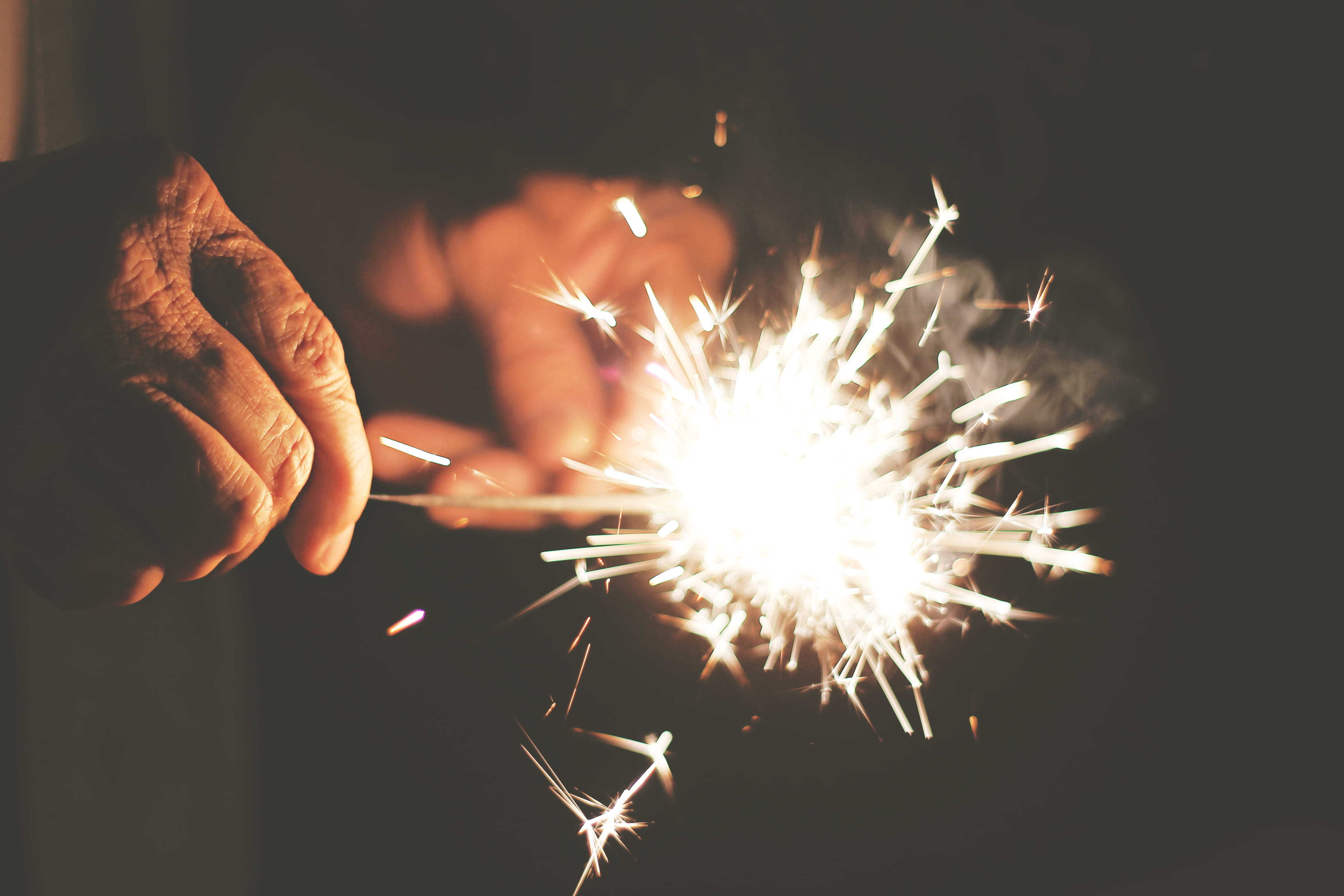 night, fire - Natural Phenomenon, firework, human body part, human Hand, glowing, photography, working, light, fire, 4K, hand, event, motion, blurred motion, HD Wallpaper