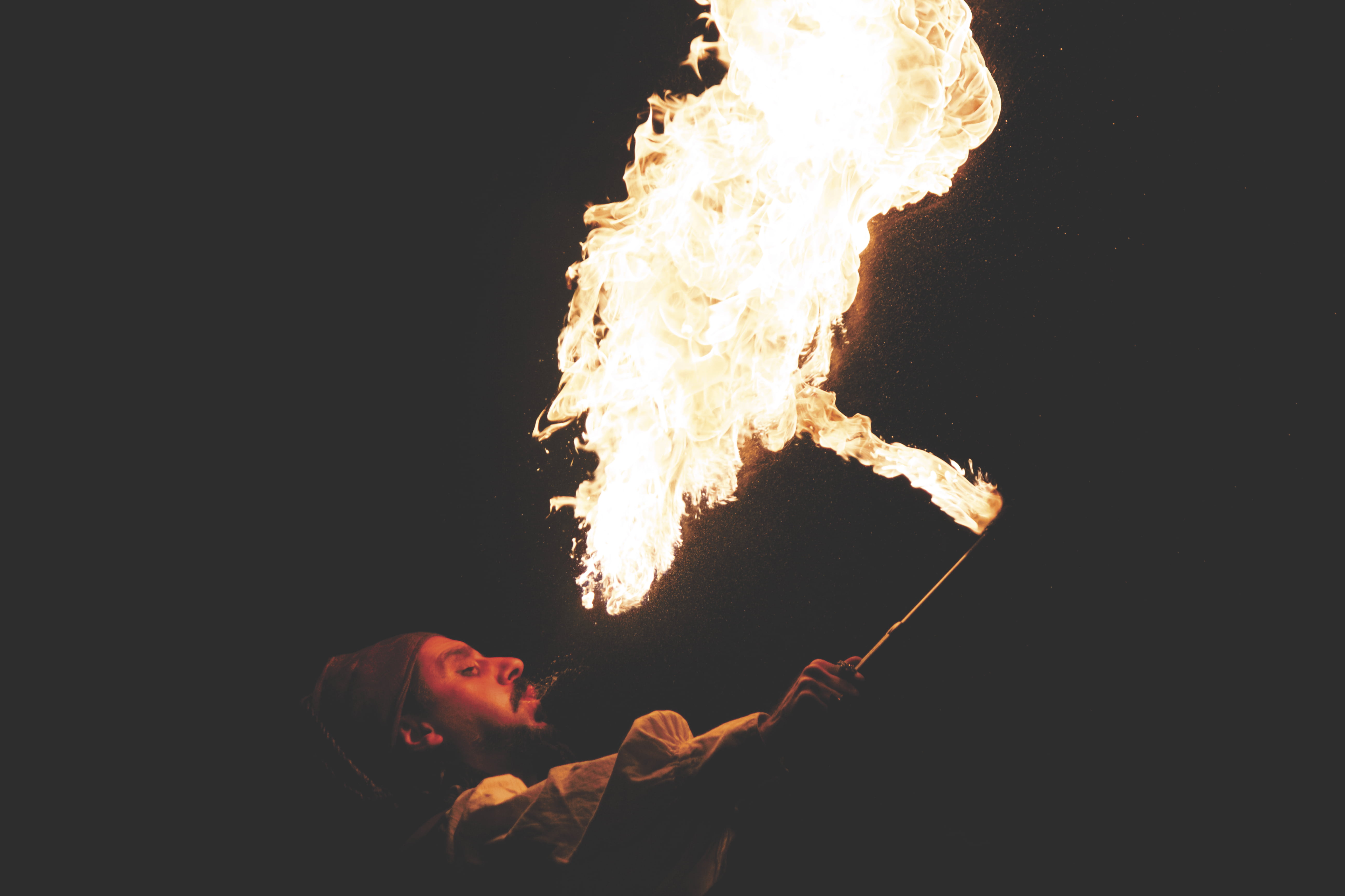 holding, fire - natural phenomenon, outdoors, man, performance, show, danger, flame, lifestyles, dancer, black, 5K, acrobat, entertainment, event, flames, HD Wallpaper