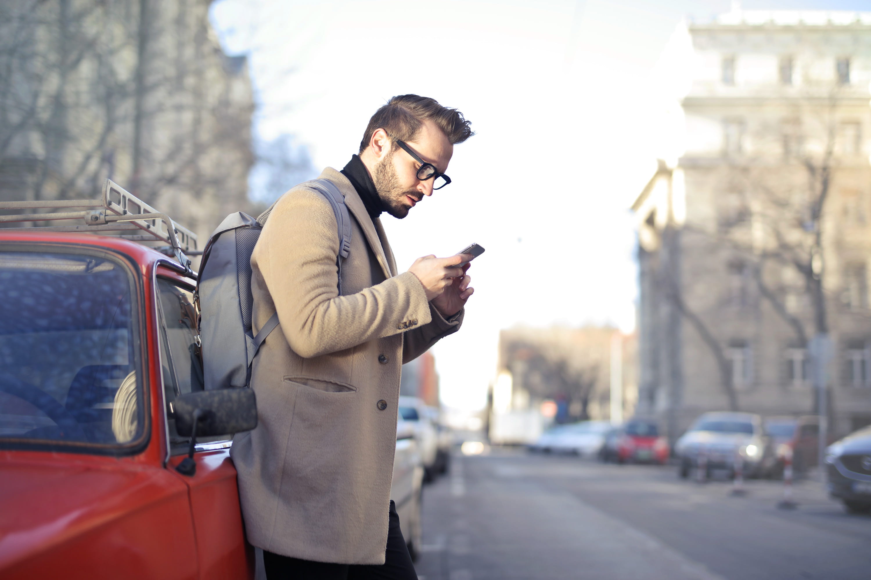 communication, city, wireless, person, eyeglasses, 2K, male, backpack, man, sunglasses, beige, motor vehicle, black sweater, looking, bag, daytime, young, HD Wallpaper