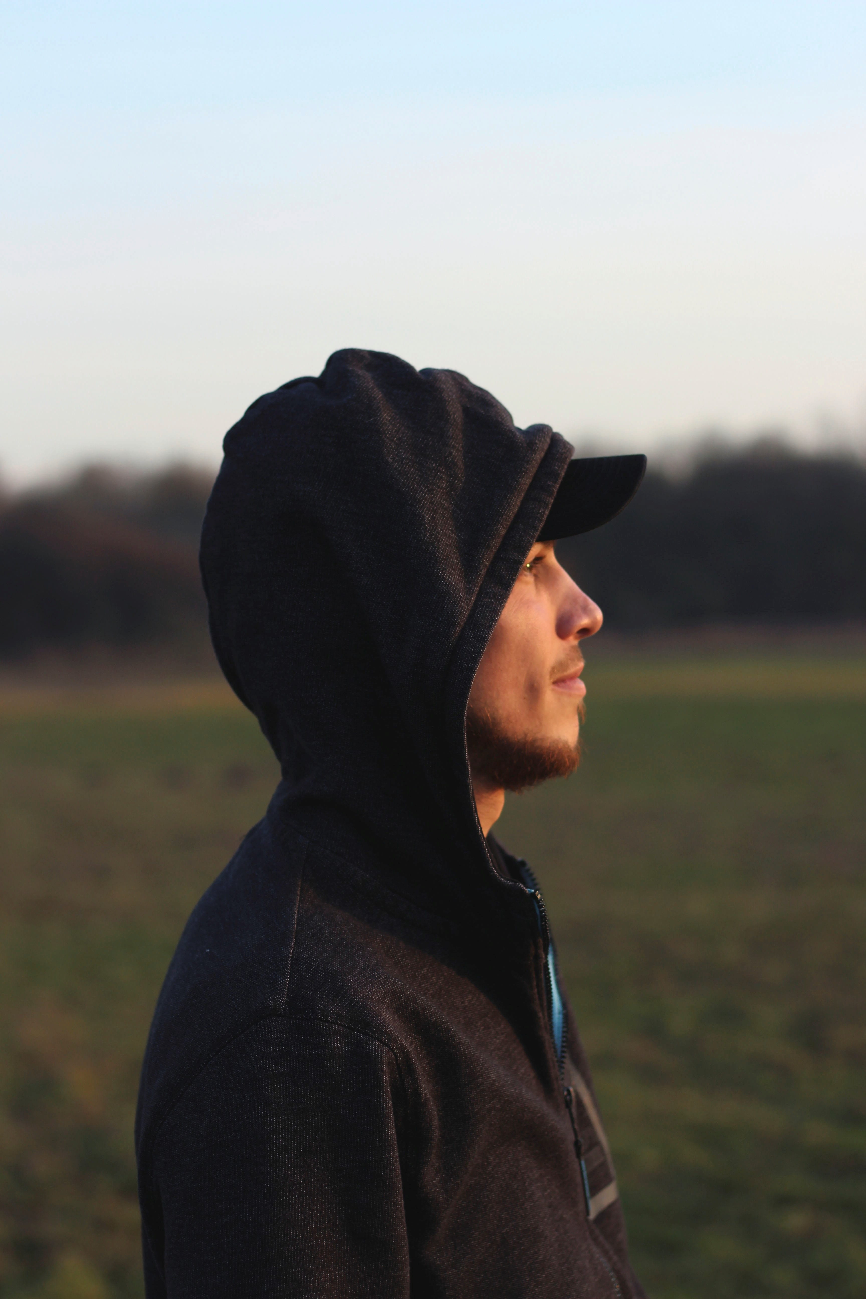 contemplation, real people, young men, casual clothing, clothing, sky, waist up, 5K, focus on foreground, portrait, standing, leisure activity, cap, male, Phone HD Wallpaper