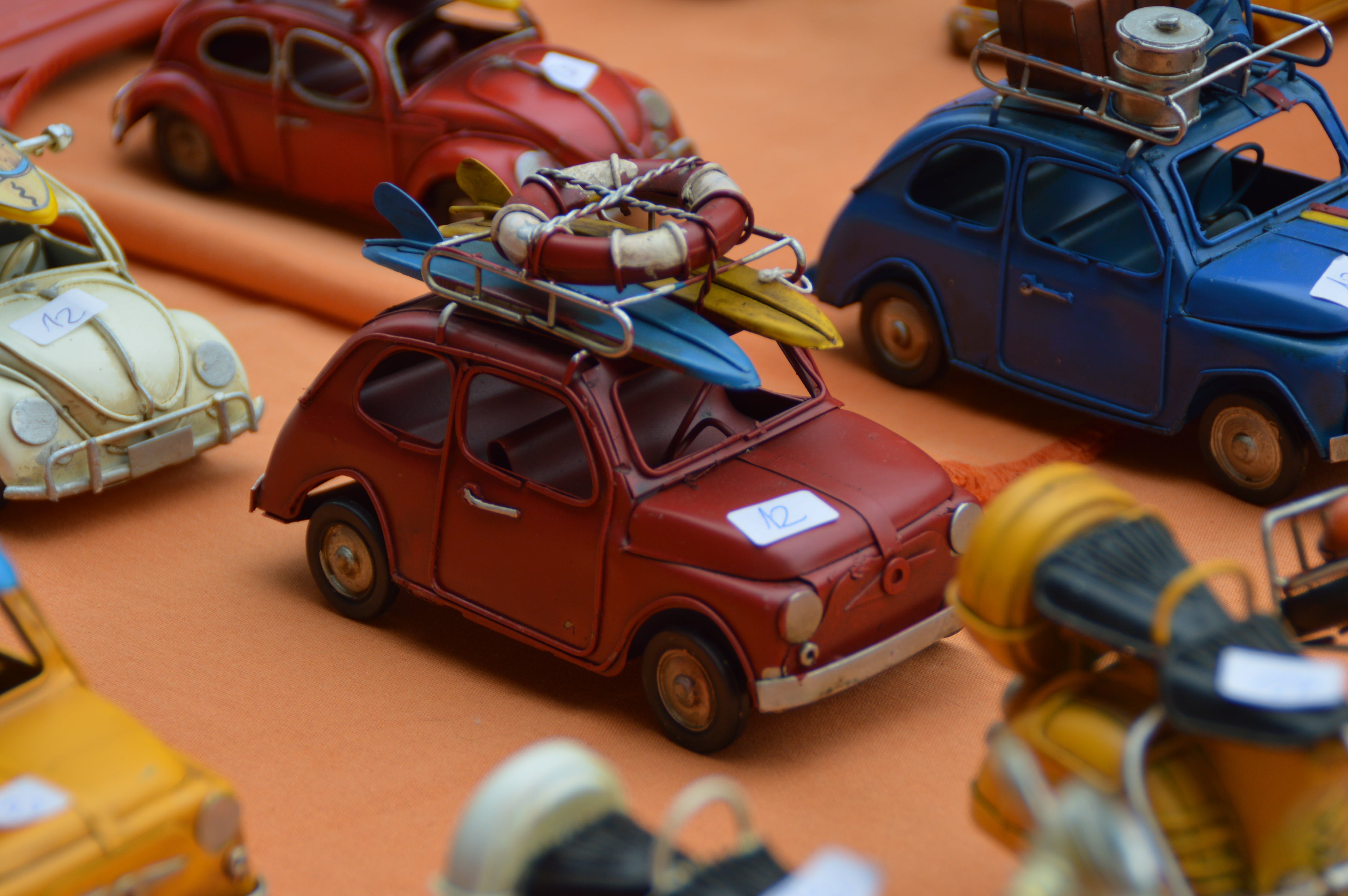 assorted, motor vehicle, human representation, selective focus, small, day, land Vehicle, close-up, toy, 4K, beetle, lot, multi colored, auto, mode of transportation, HD Wallpaper