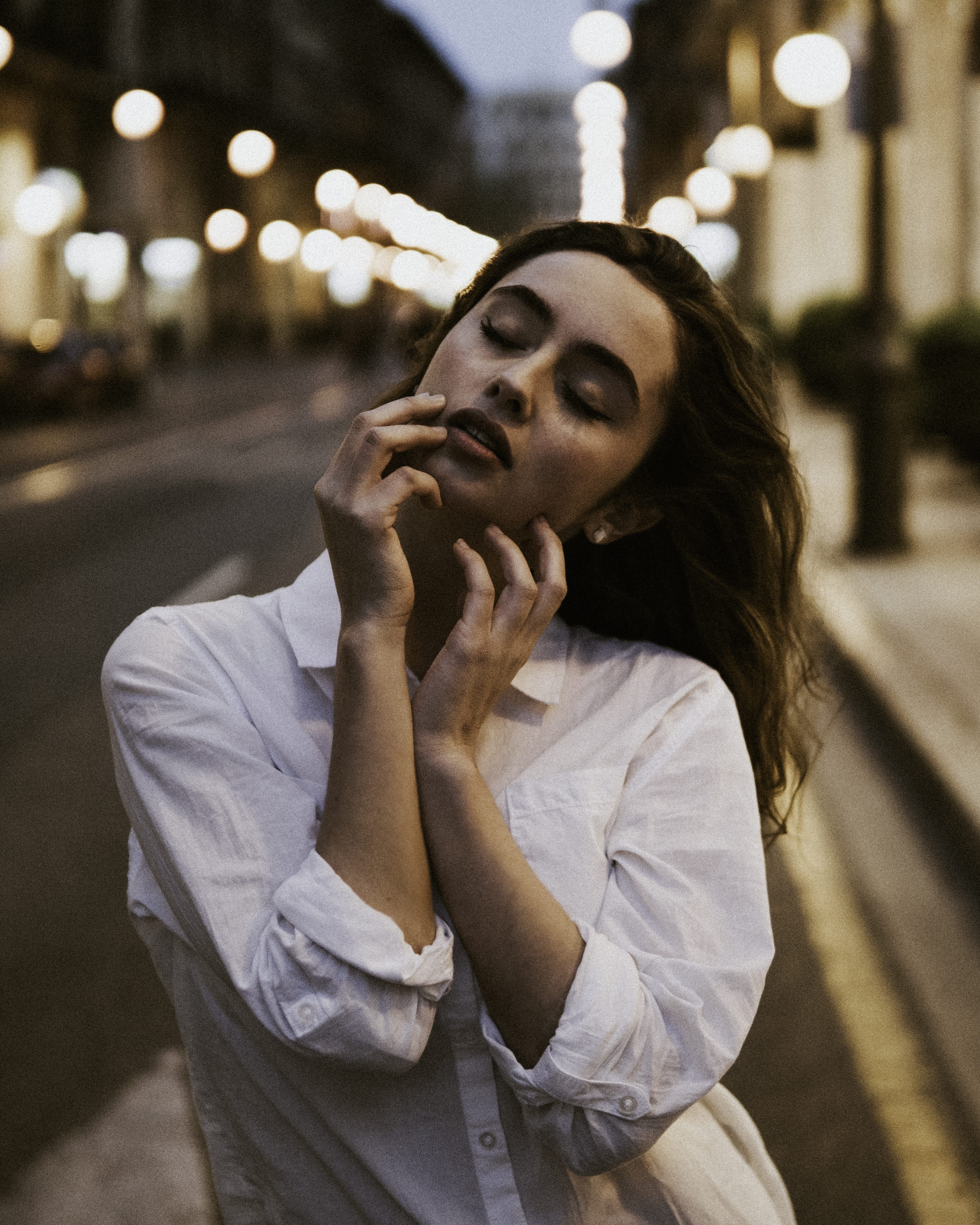 portrait, hands on face, street, photography, fade, real people, brown hair, front, selective, beautiful woman, waist up, dreaming, contemplation, one person, Phone HD Wallpaper