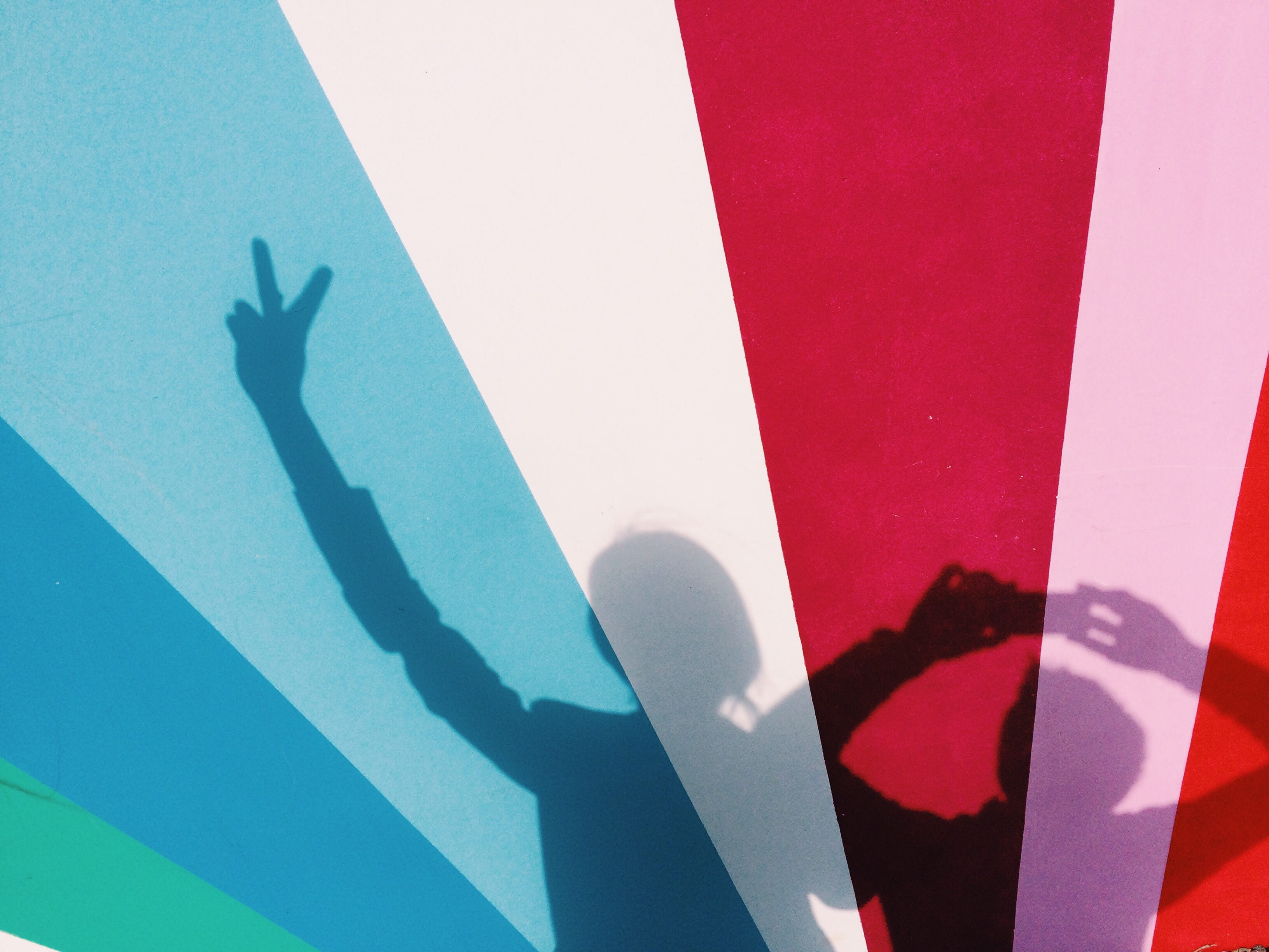 focus on shadow, panel, shadow, unrecognizable person, wall - building feature, multicolored, two, hand, human body part, blue, painting, arms raised, advertisement, HD Wallpaper