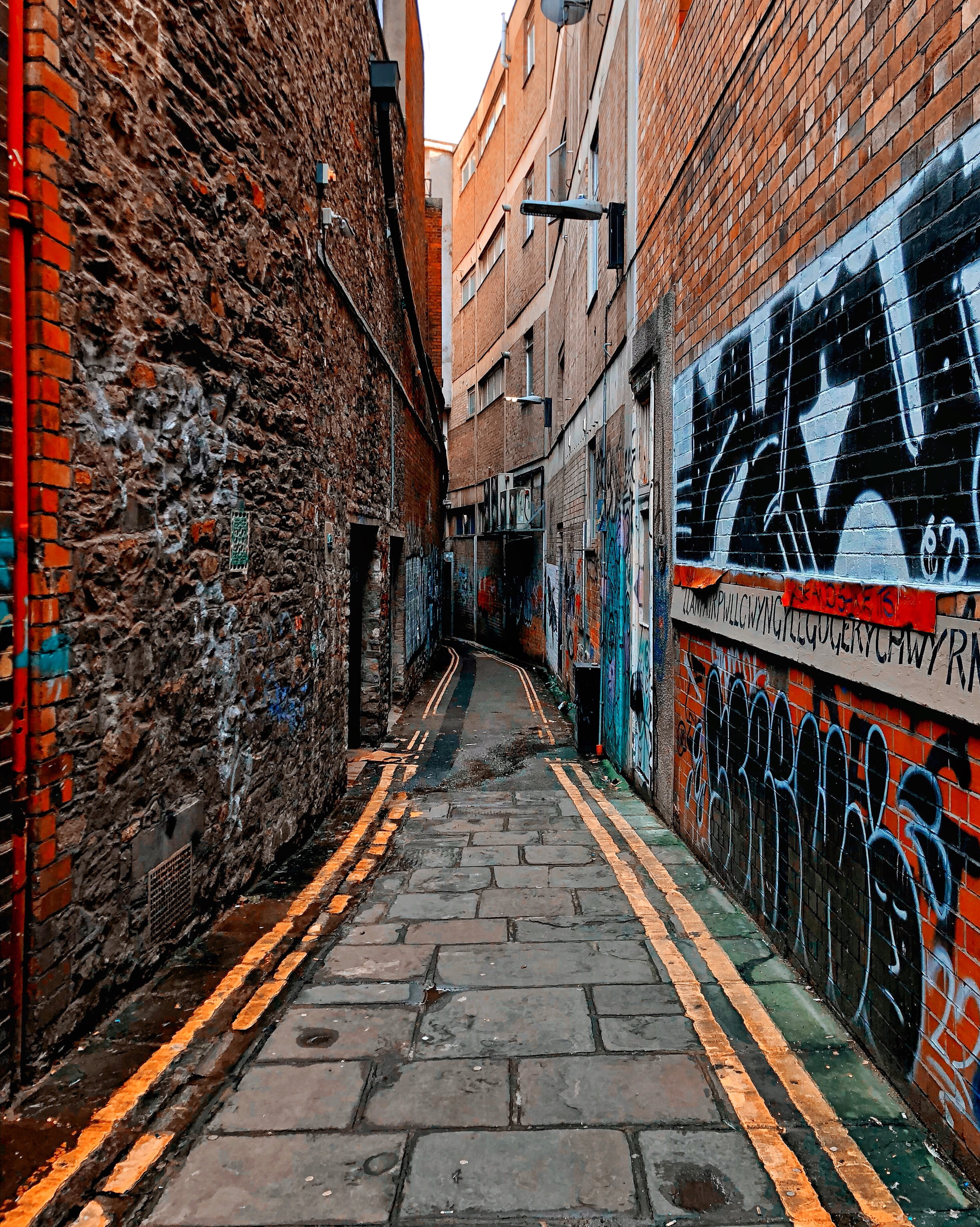 walls, alley, alleyway, drawing, wall, brick, city, building exterior, urban, building, direction, town, no people, bristol, brick wall, architecture, footpath, Phone HD Wallpaper