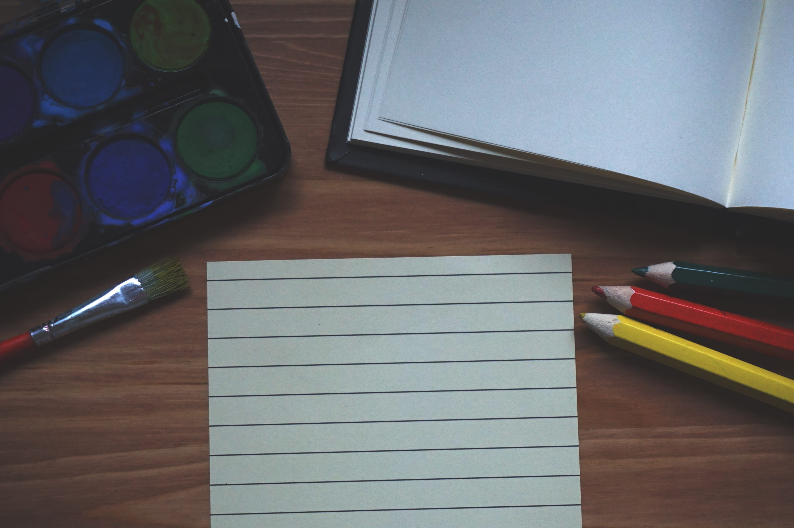 earphones, palette, water, painting, pen, pencils, no people, table, color, writing instrument, 2K, book, paper, brush, high angle view, office supply, HD Wallpaper